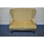 A REPRODUCTION WINGBACK TWO SEATER SOFA, on front cabriole legs, width 121cm x depth 73cm x height