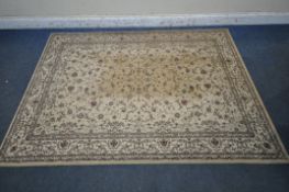 A DUNELM RECTANGULAR RUG, depicting repeating foliate patterns, with a multi-strap border, 228cm x