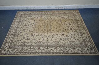 A DUNELM RECTANGULAR RUG, depicting repeating foliate patterns, with a multi-strap border, 228cm x