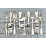 A MATCHED SET OF ELEVEN GEORGE IV TO VICTORIAN SILVER FIDDLE PATTERN TABLE FORKS, including a set of