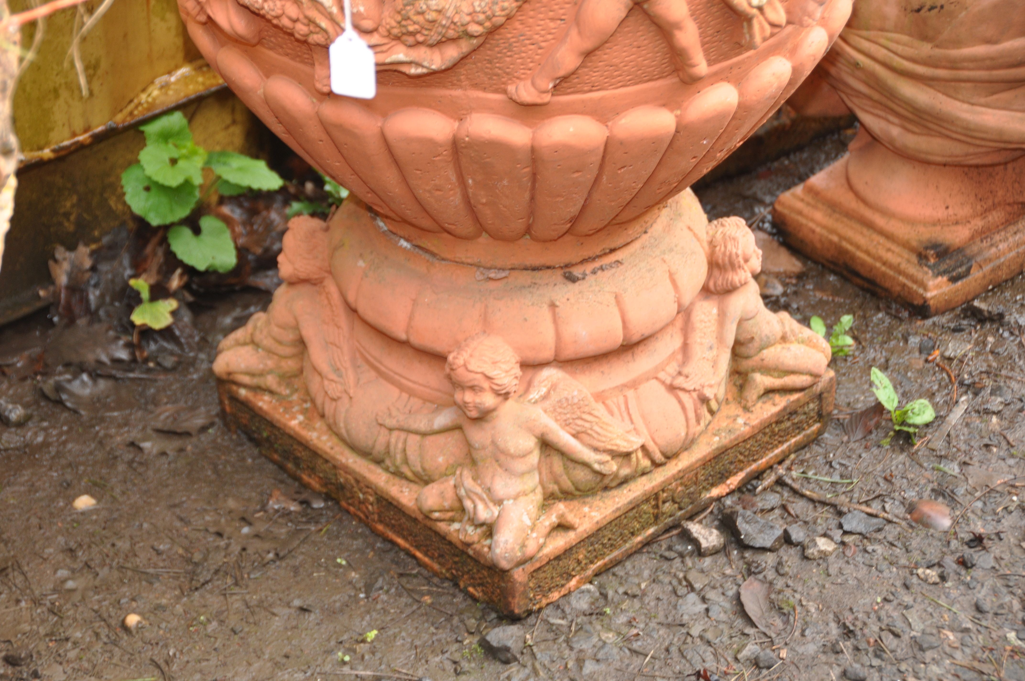 A PAIR OF LARGE MODERN COMPOSITE GARDEN URNS, terracotta painted, with Cherubs holding garlands of - Image 5 of 5