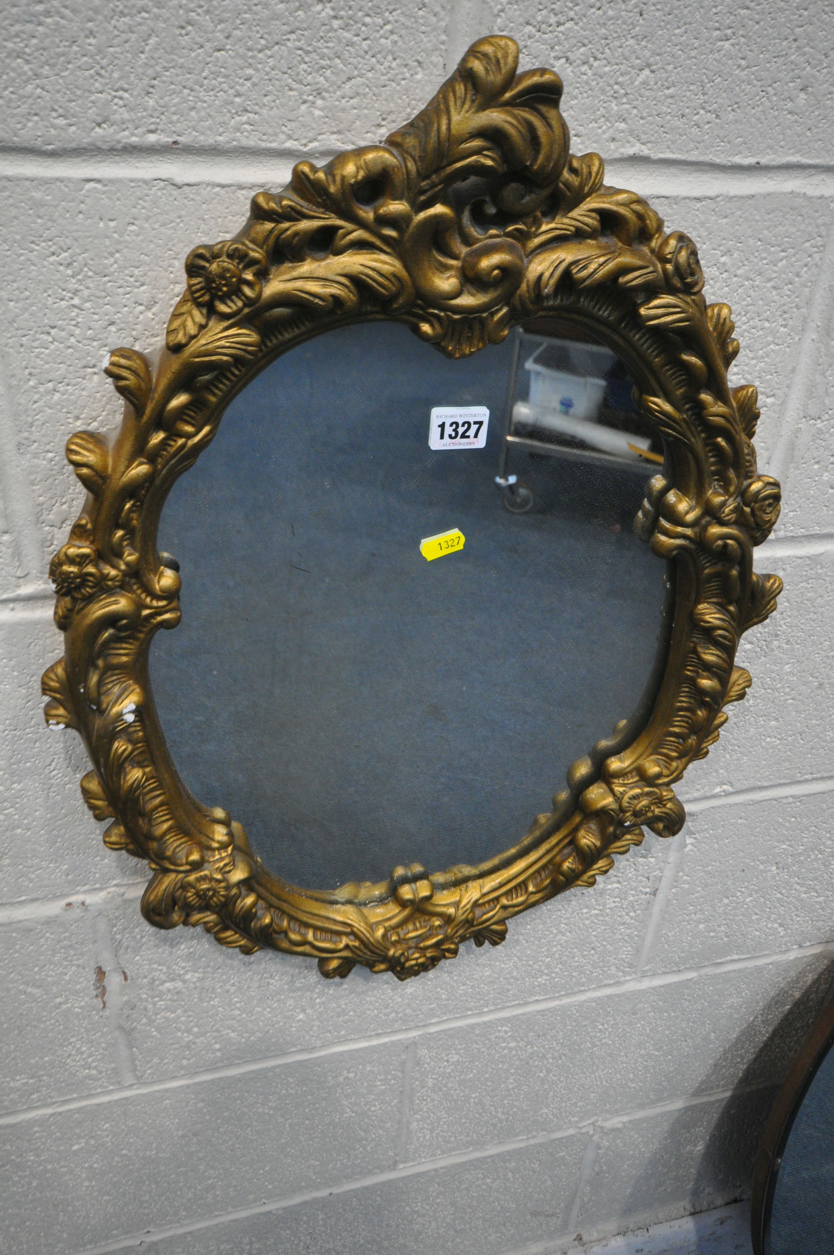 A GILT RESIN WALL MIRROR, with foliate frame, 45cm x 62cm, along with a circular bevelled edge - Image 2 of 3