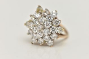 A 9CT GOLD CUBIC ZIRCONIA CLUSTER RING, designed as four tiers of claw set, circular colourless