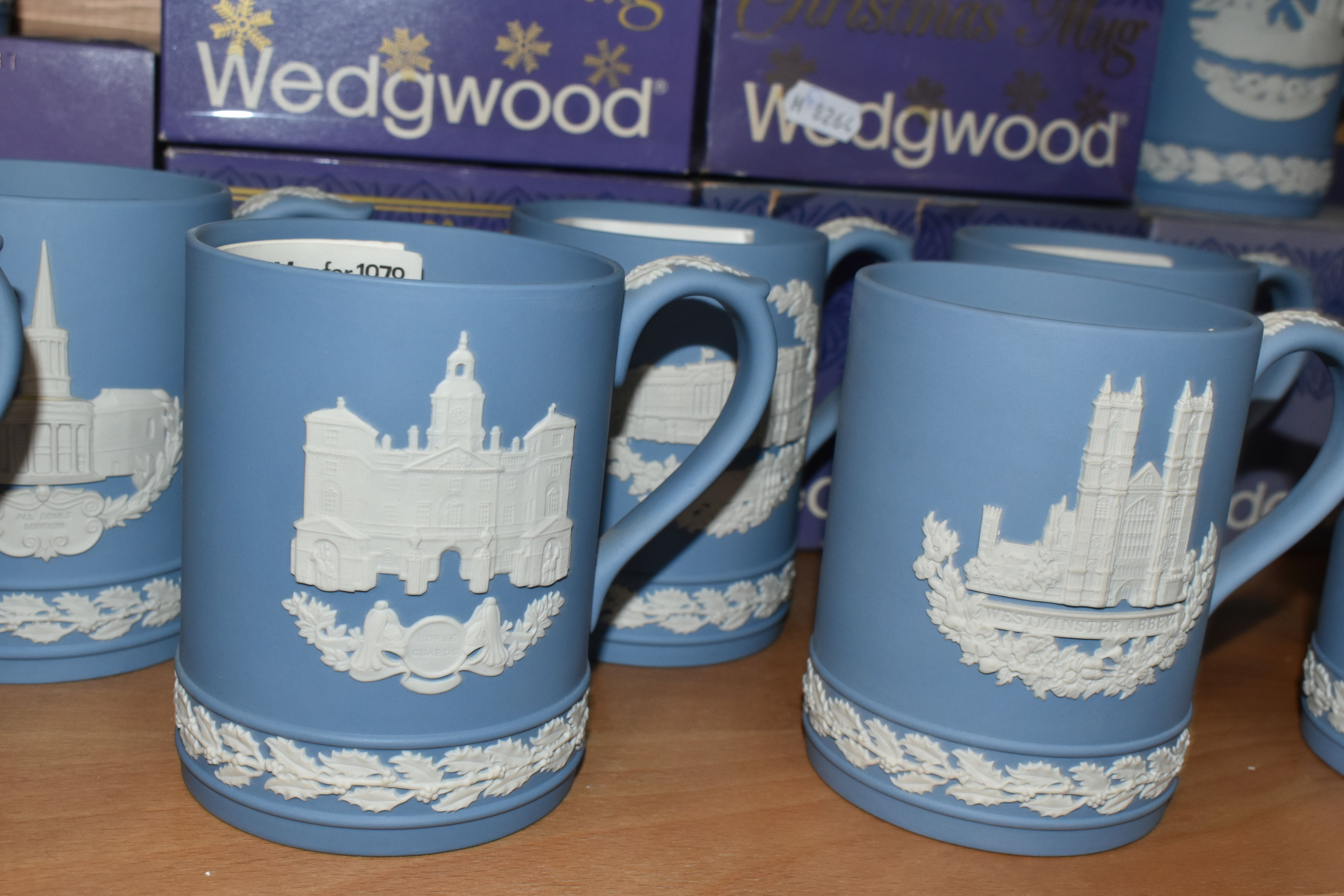 FIFTEEN WEDGWOOD JASPERWARE CHRISTMAS MUGS, in pale blue, decorated with Royal Palaces and London - Image 3 of 6