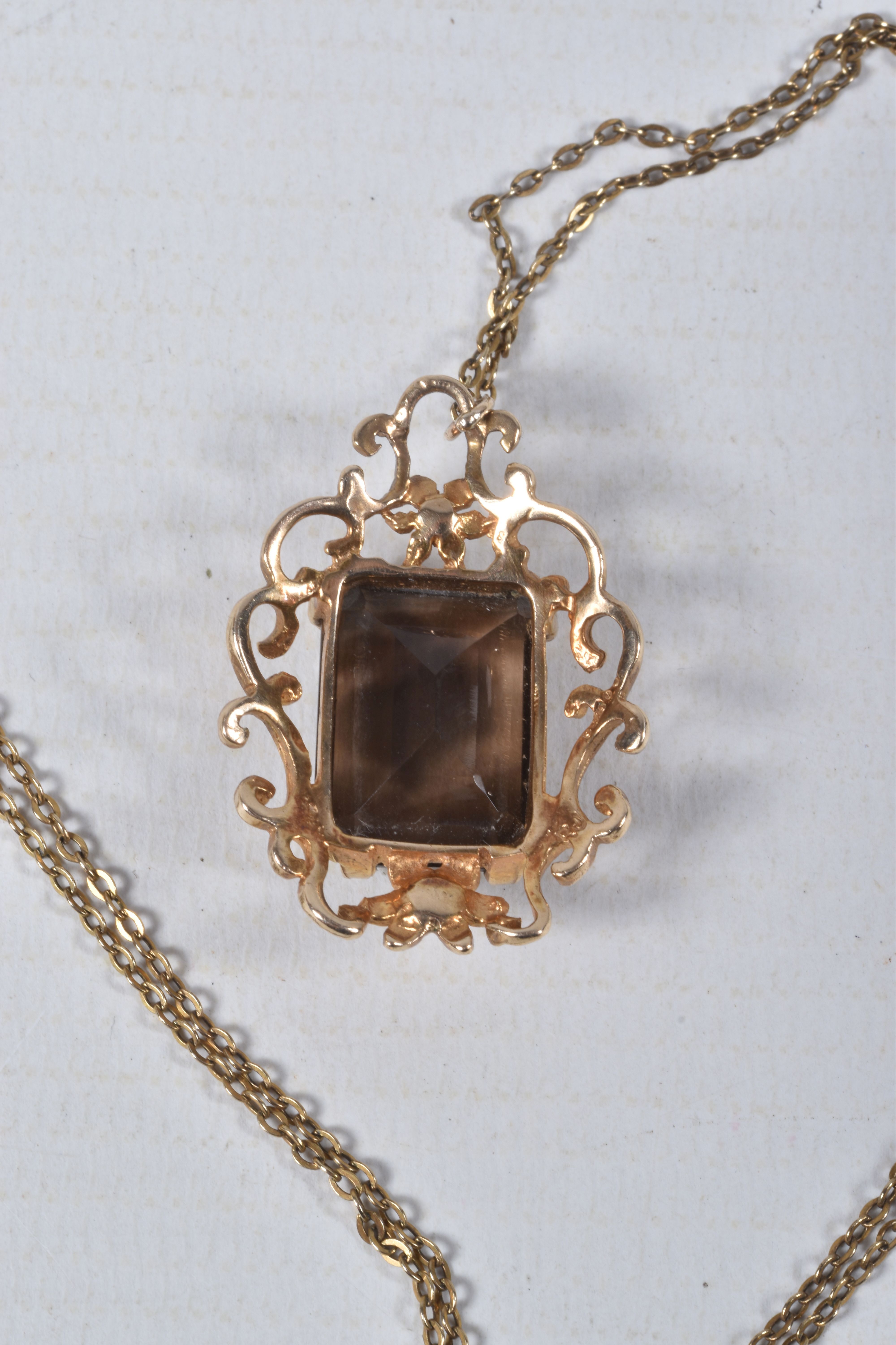 A 9CT SMOKY QUARTZ PENDANT NECKLACE, the rectangular smoky quartz in a claw setting to the scrolling - Image 4 of 4