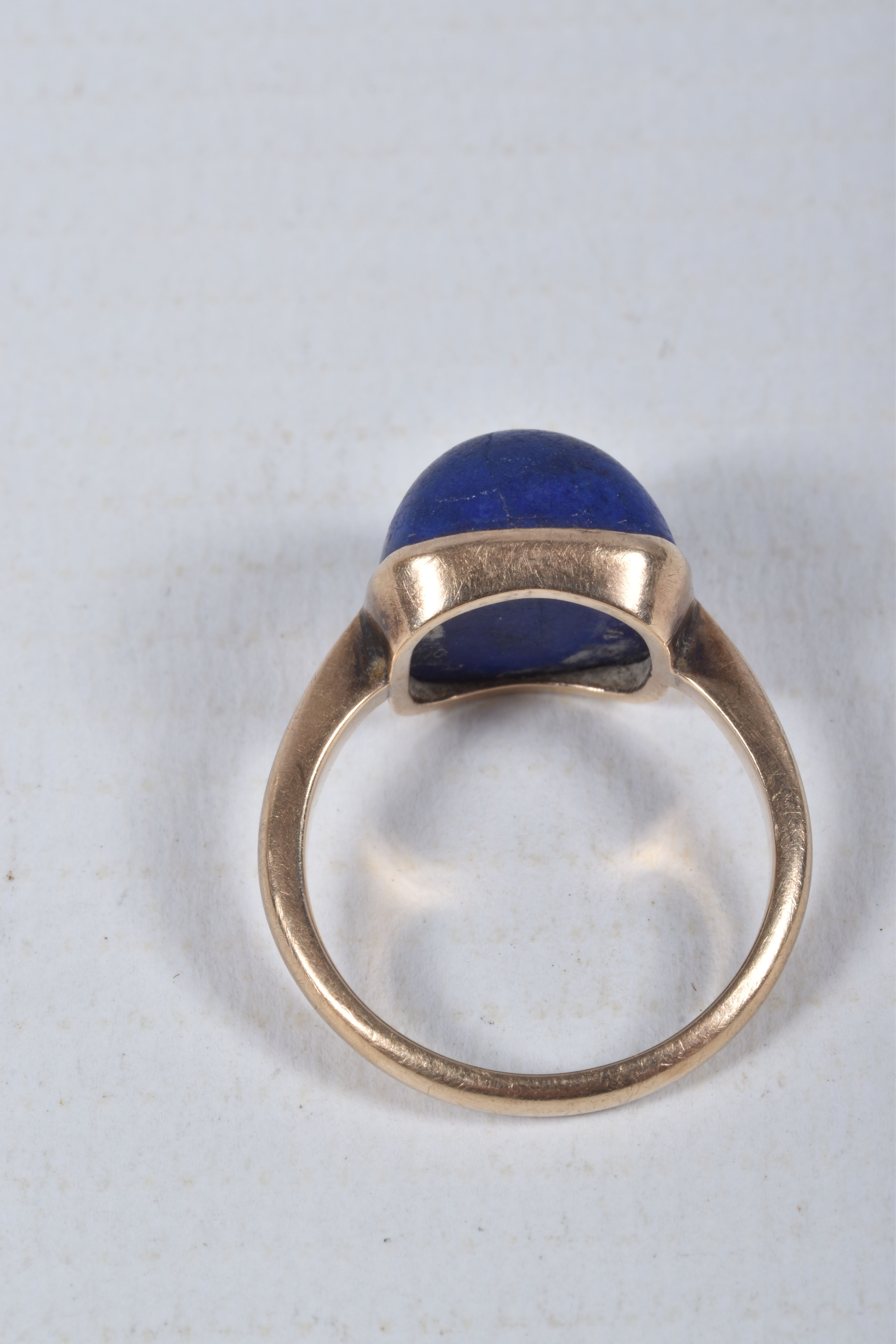 A LAPIS LAZULI RING, designed as a square lapis lazuli cabochon in a collet setting to the plain - Image 4 of 4