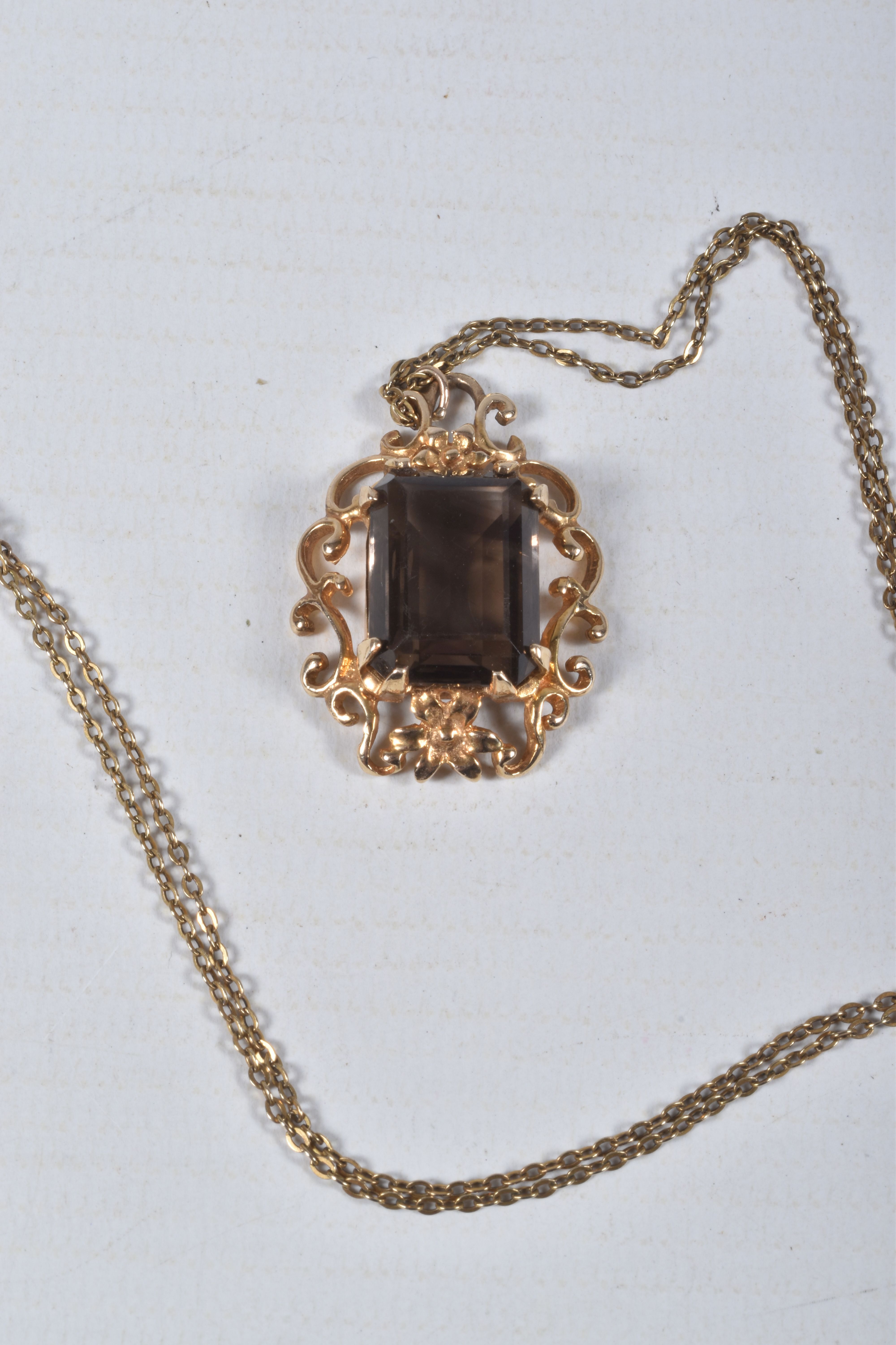 A 9CT SMOKY QUARTZ PENDANT NECKLACE, the rectangular smoky quartz in a claw setting to the scrolling - Image 3 of 4