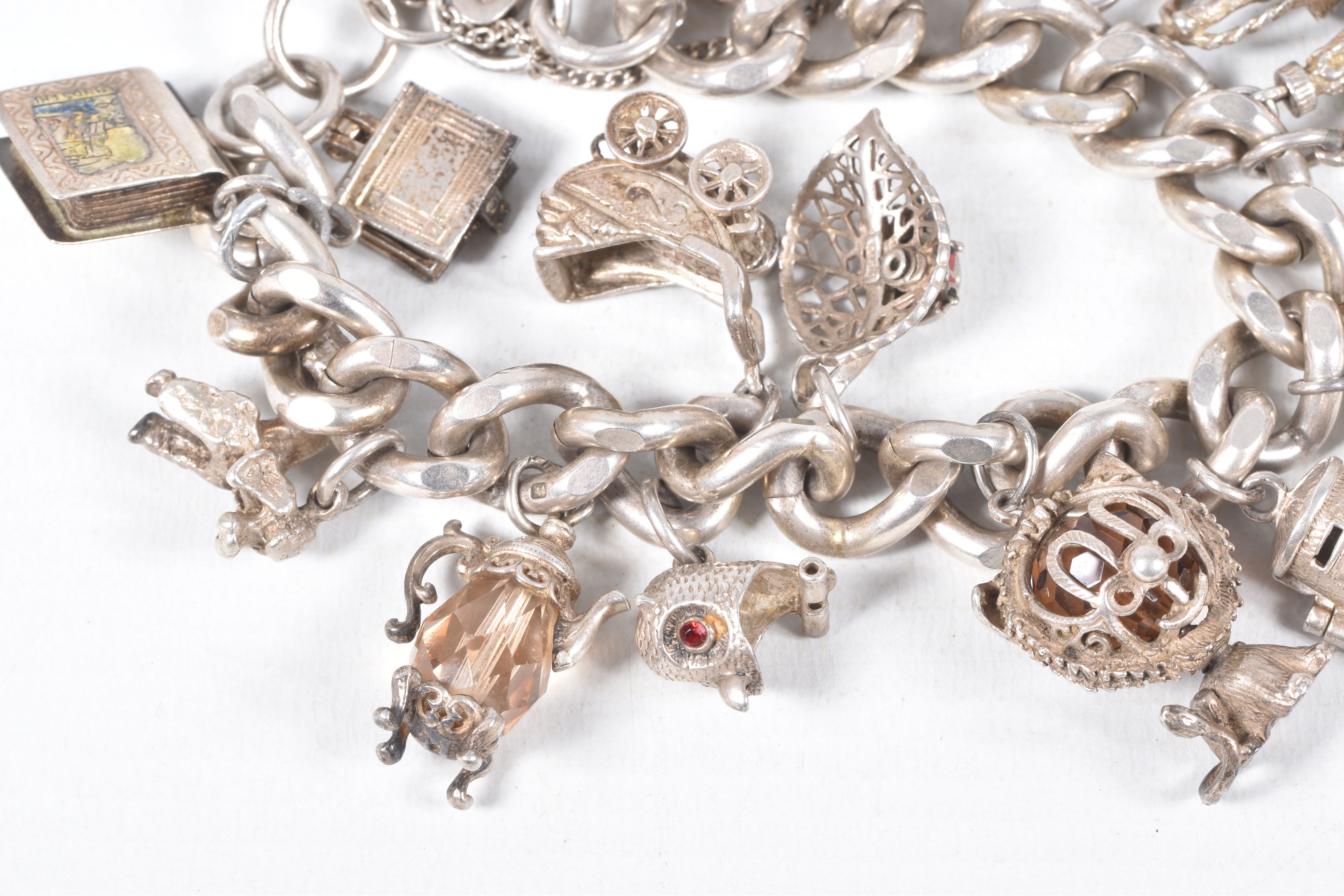 A SILVER CHARM BRACELET, a heavy curb link bracelet fitted with a heart padlock clasp, hallmarked ' - Image 4 of 7