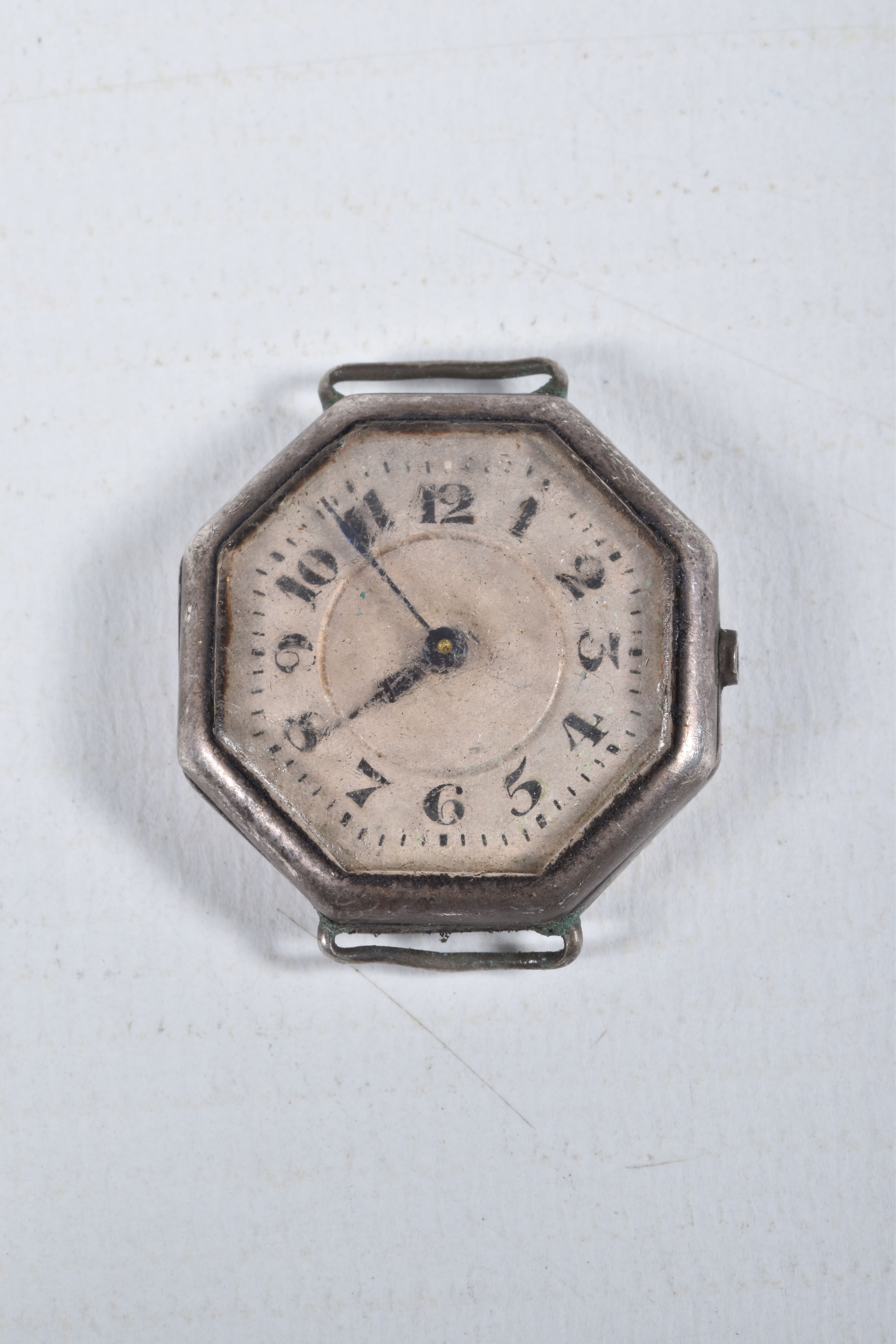 FOUR MID 20TH CENTURY WATCH HEADS, to include a white metal 'Olma' watch head, missing crown, - Image 8 of 9