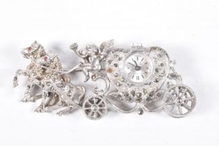 A WHITE METAL WATCH BROOCH, designed as a carriage with a cherub and two horses, set with marcasite,