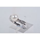 A MODERN 9CT WHITE GOLD CULTURED PEARL AND DIAMOND RING, set with a cultured pearl, measuring