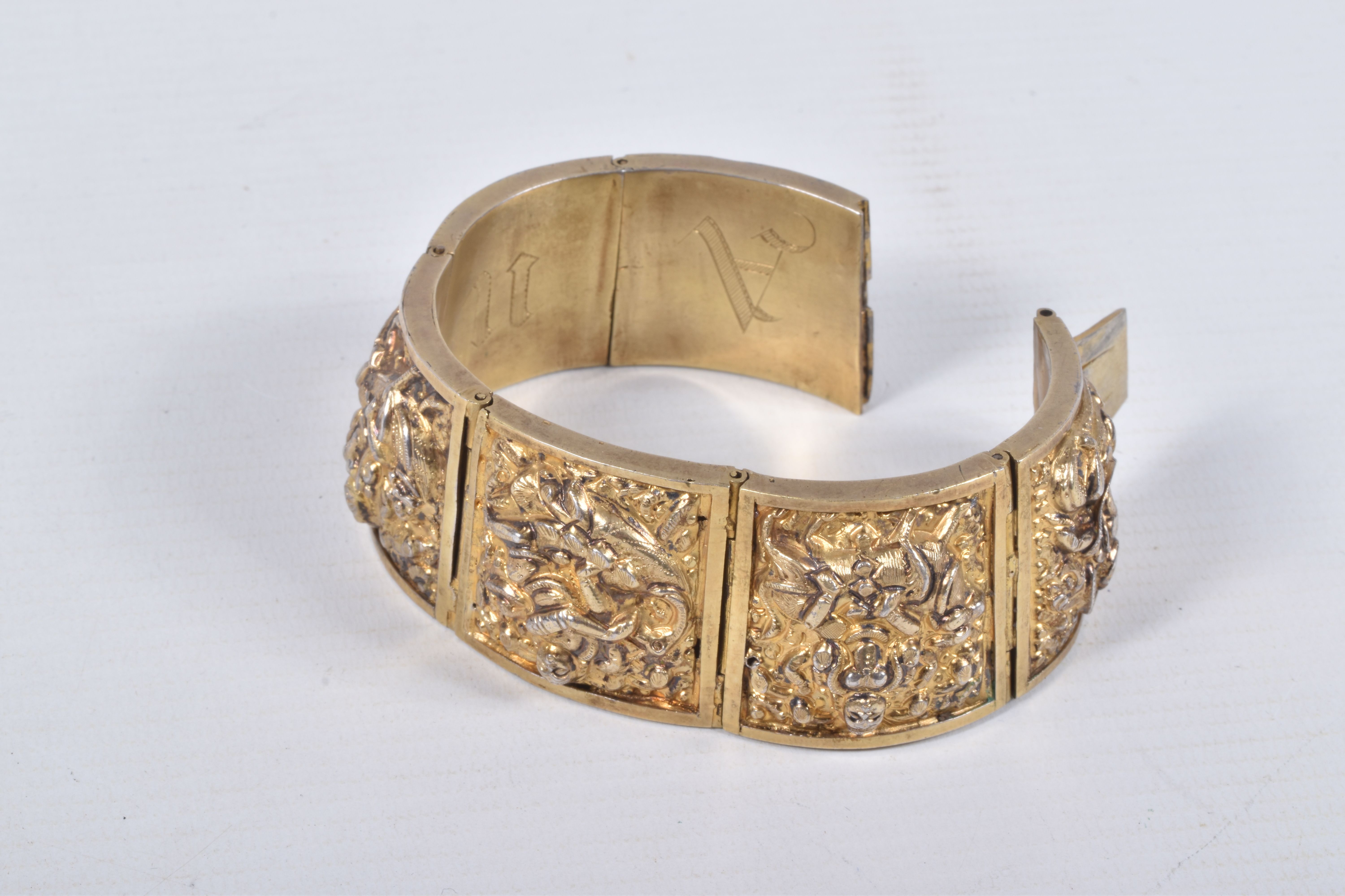 A VICTORIAN GILT BRACELET, comprised of six slightly tapered panels, embossed with an Indian design, - Image 2 of 5