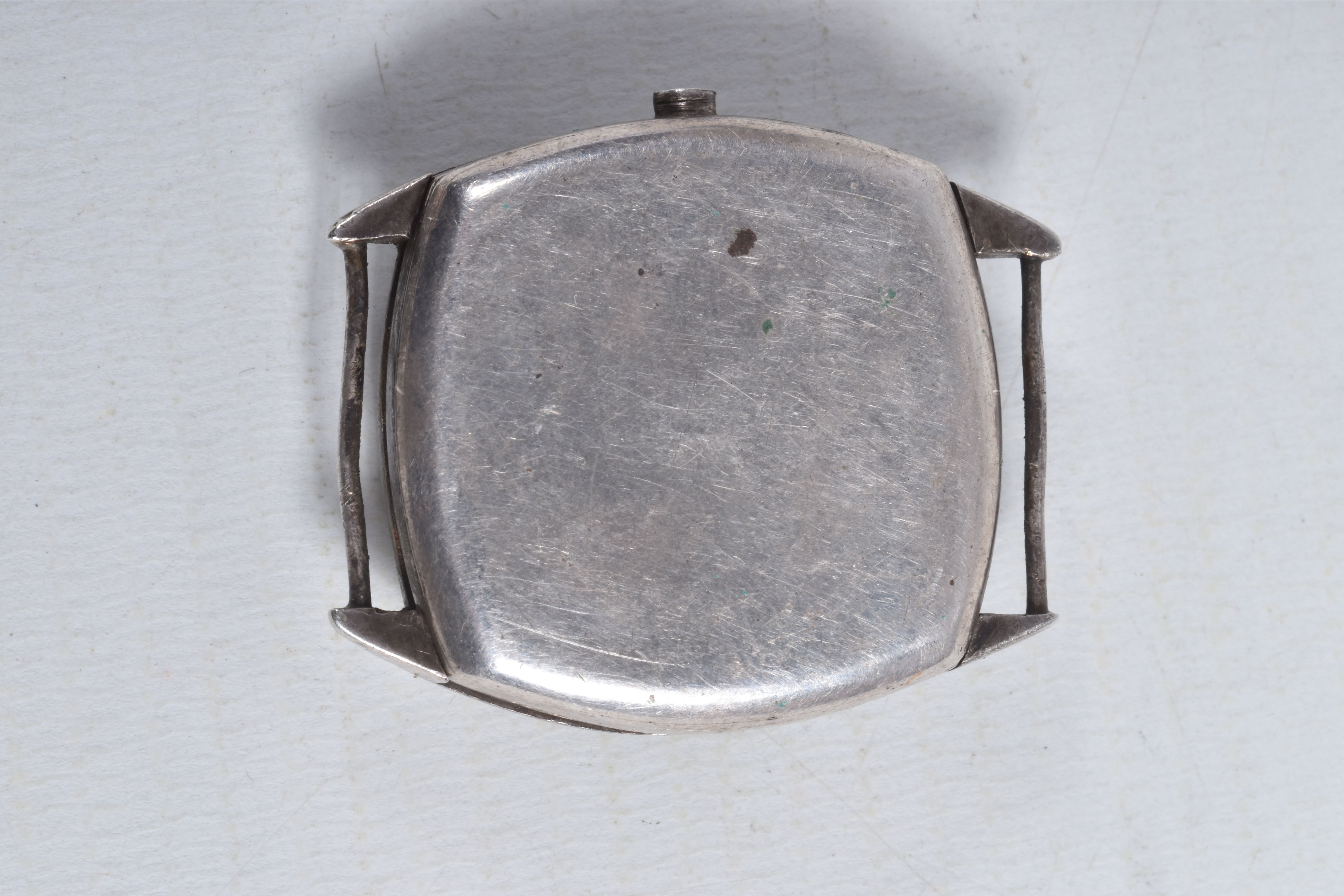 FOUR MID 20TH CENTURY WATCH HEADS, to include a white metal 'Olma' watch head, missing crown, - Image 5 of 9