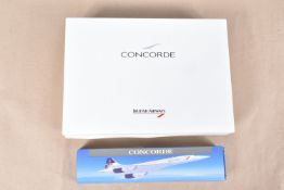 THREE CONCORDE FOLDERS AND A MODEL TOY OF THE AIRCRAFT, the boxed model with British Airways to