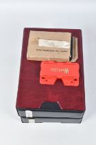 A BOXED CAVANDERS CARD VIEWER AND AN ALBUM OF CAVANDERS STEREOSCOPIC CARDS,