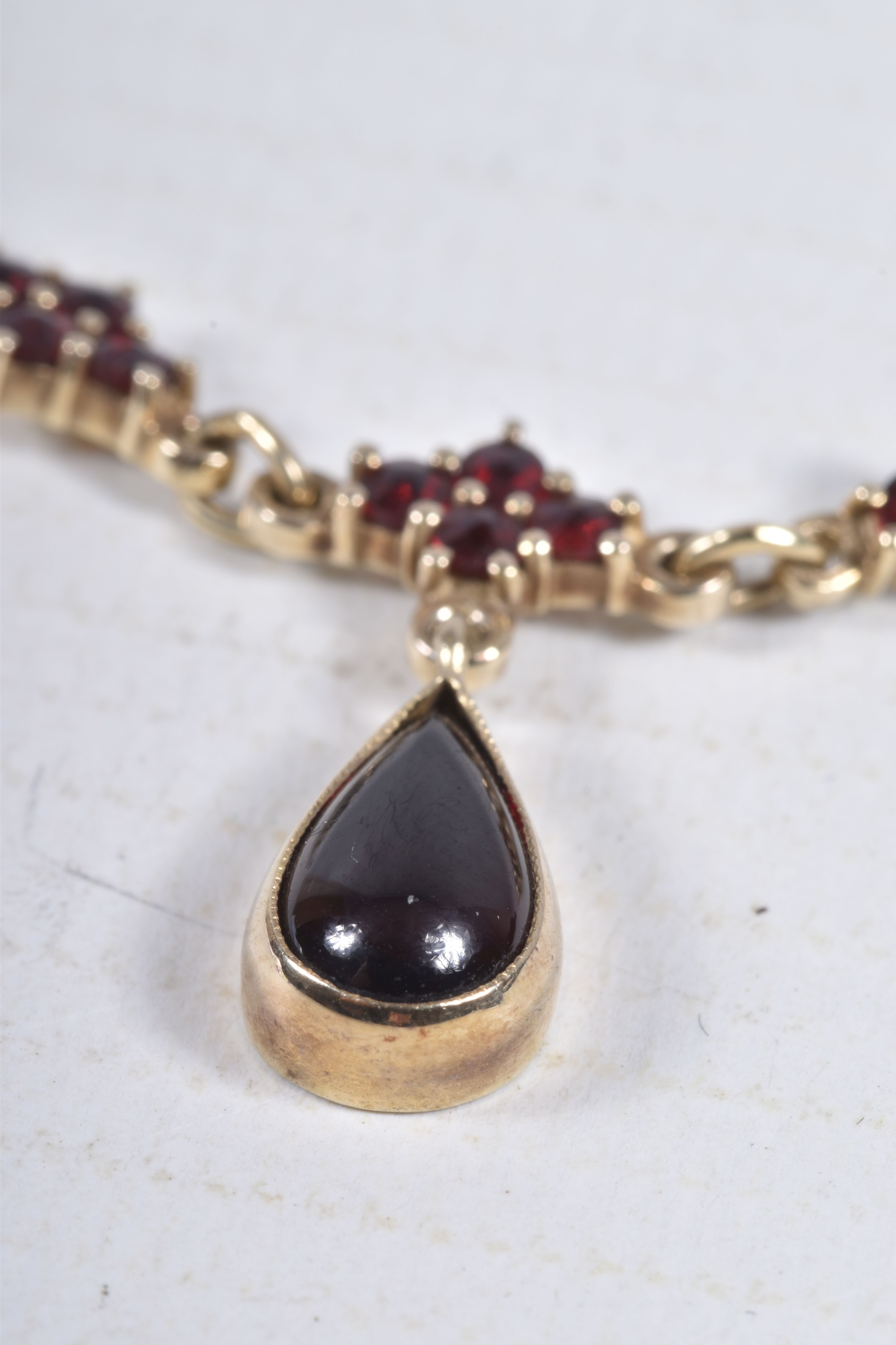 A CZECHOSLOVAKIA SILVER GILT, GARNET NECKLACE, pear cut garnet cabochon dropper in a milgrain - Image 2 of 5