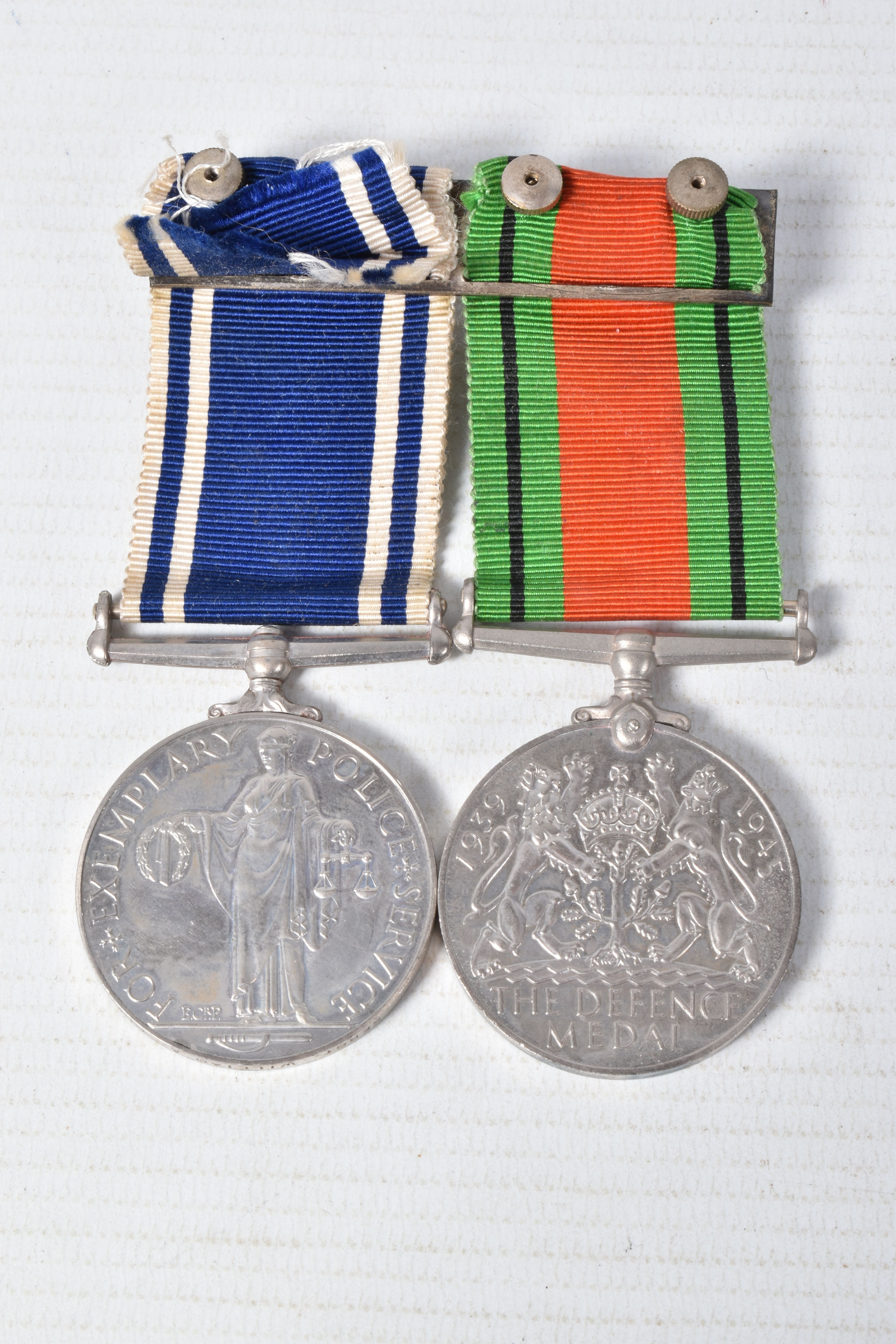 A POLICE LONG SERVICE MEDAL AND WWII DEFENCE MEDAL, police cap badge and epaulette numbers, the - Image 7 of 7