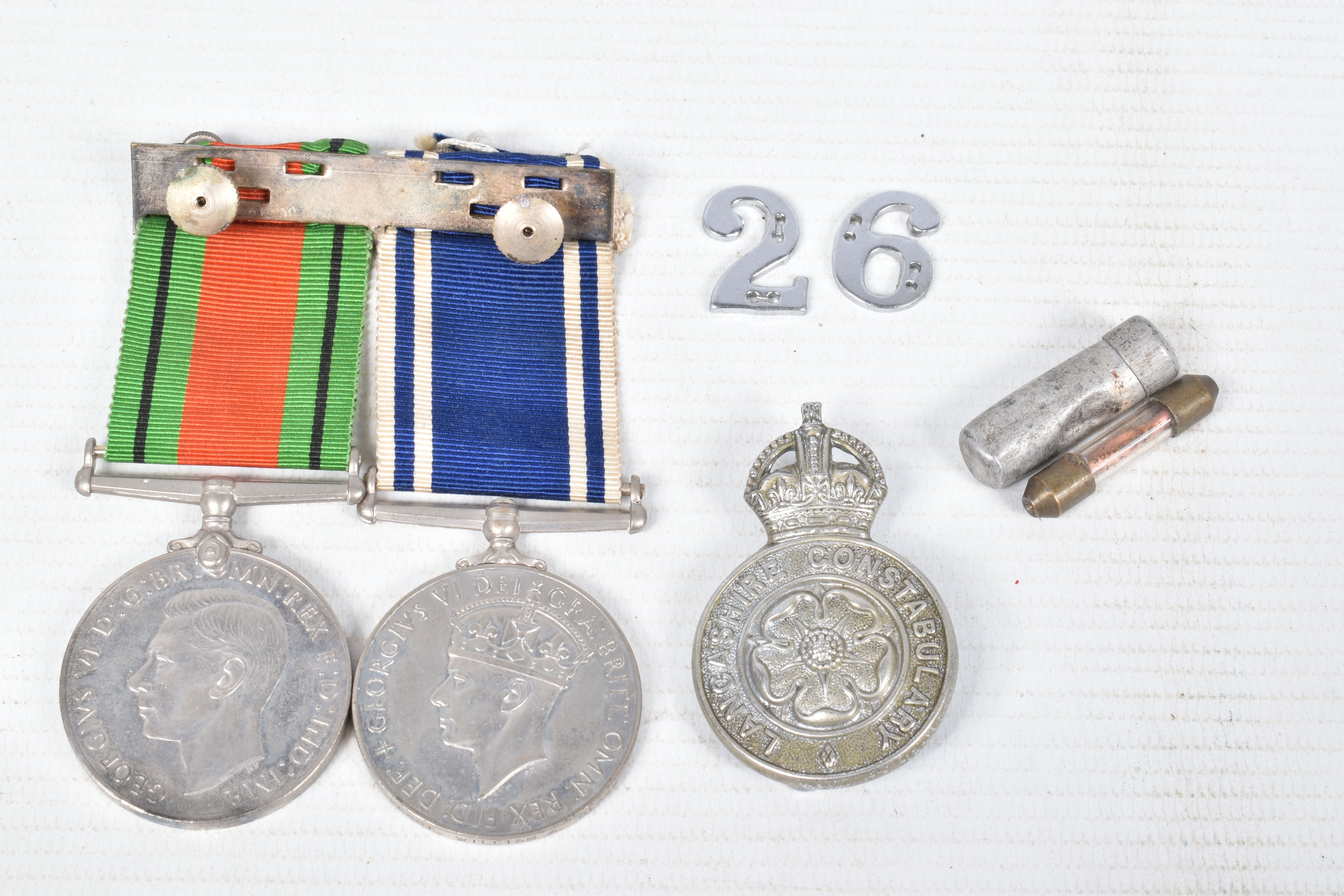 A POLICE LONG SERVICE MEDAL AND WWII DEFENCE MEDAL, police cap badge and epaulette numbers, the - Image 3 of 7