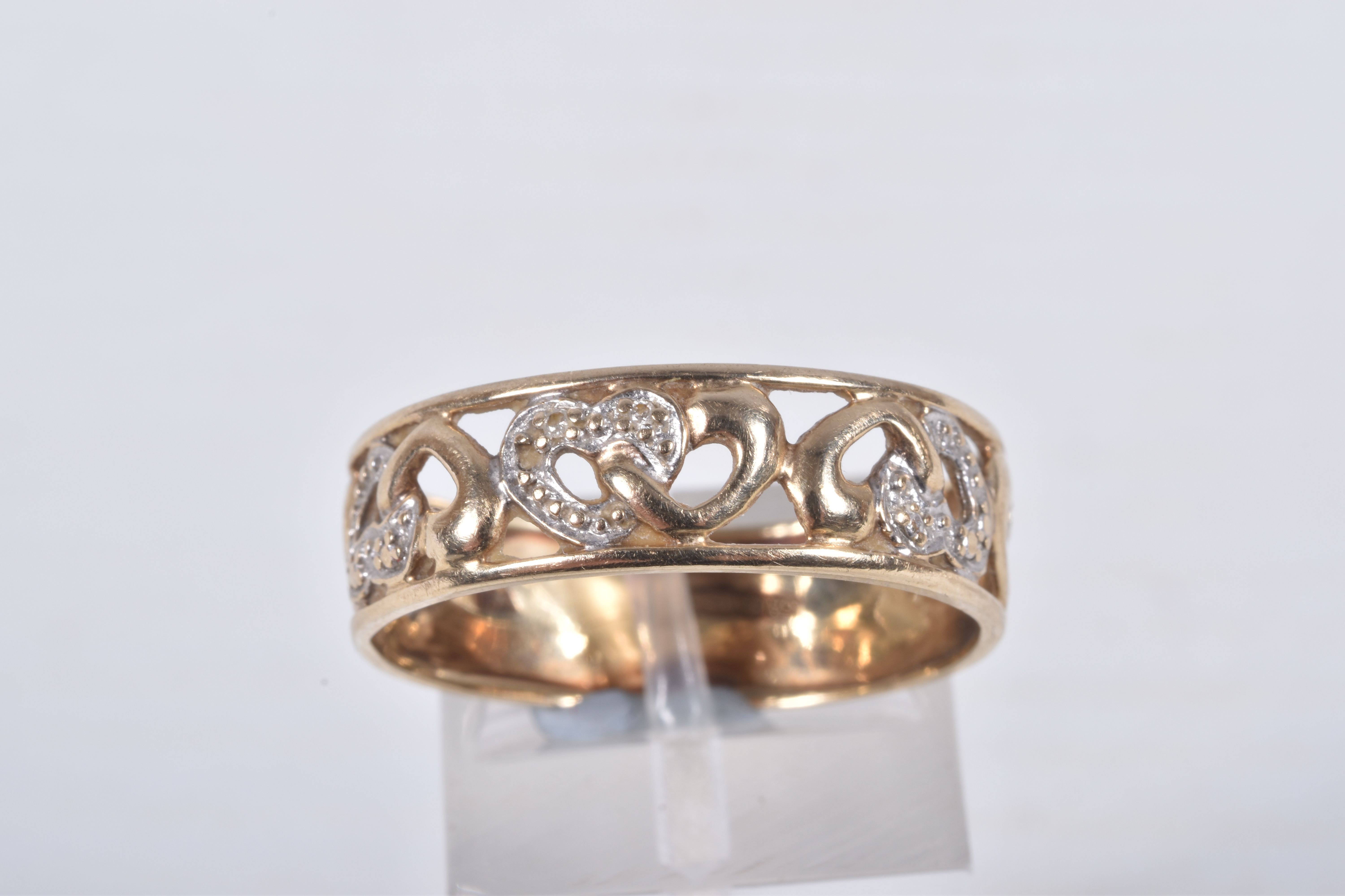 A 9CT GOLD BAND RING, open work wide band, detailed with hearts set with single cut diamond accents, - Image 2 of 4