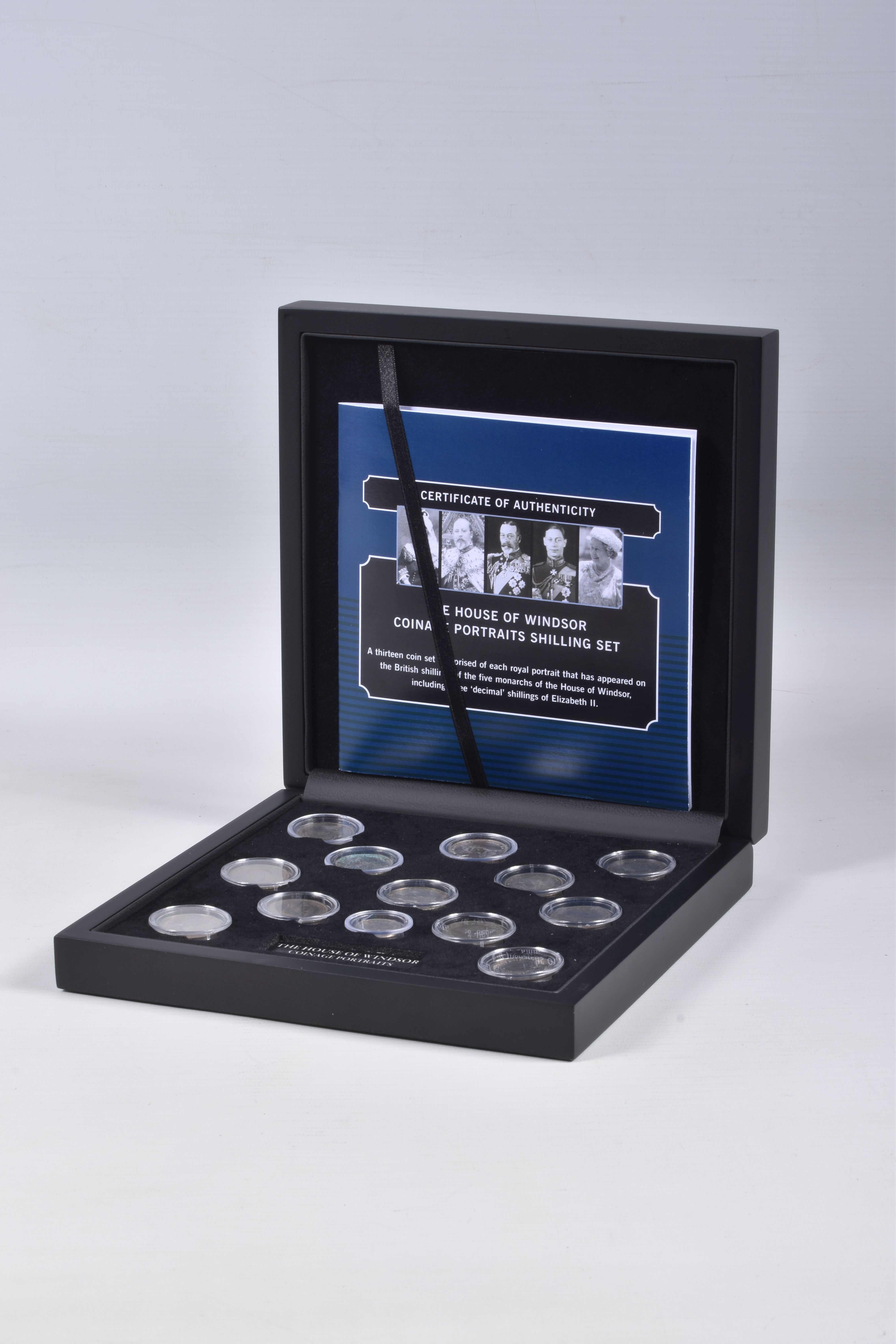 A CASED SET OF COMMEMORATIVE COINS, The House of Windsor coinage portraits shilling set by The