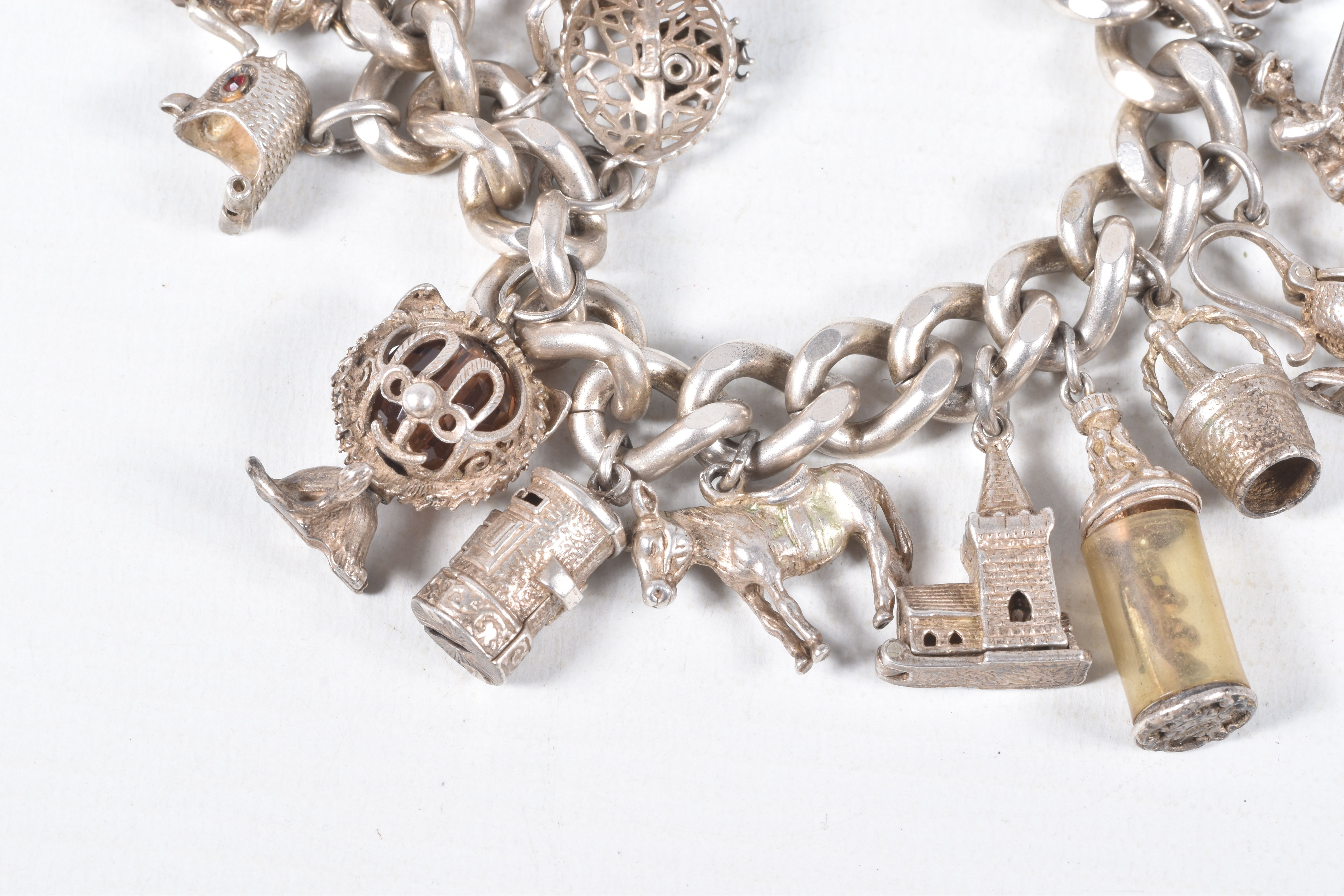 A SILVER CHARM BRACELET, a heavy curb link bracelet fitted with a heart padlock clasp, hallmarked ' - Image 3 of 7