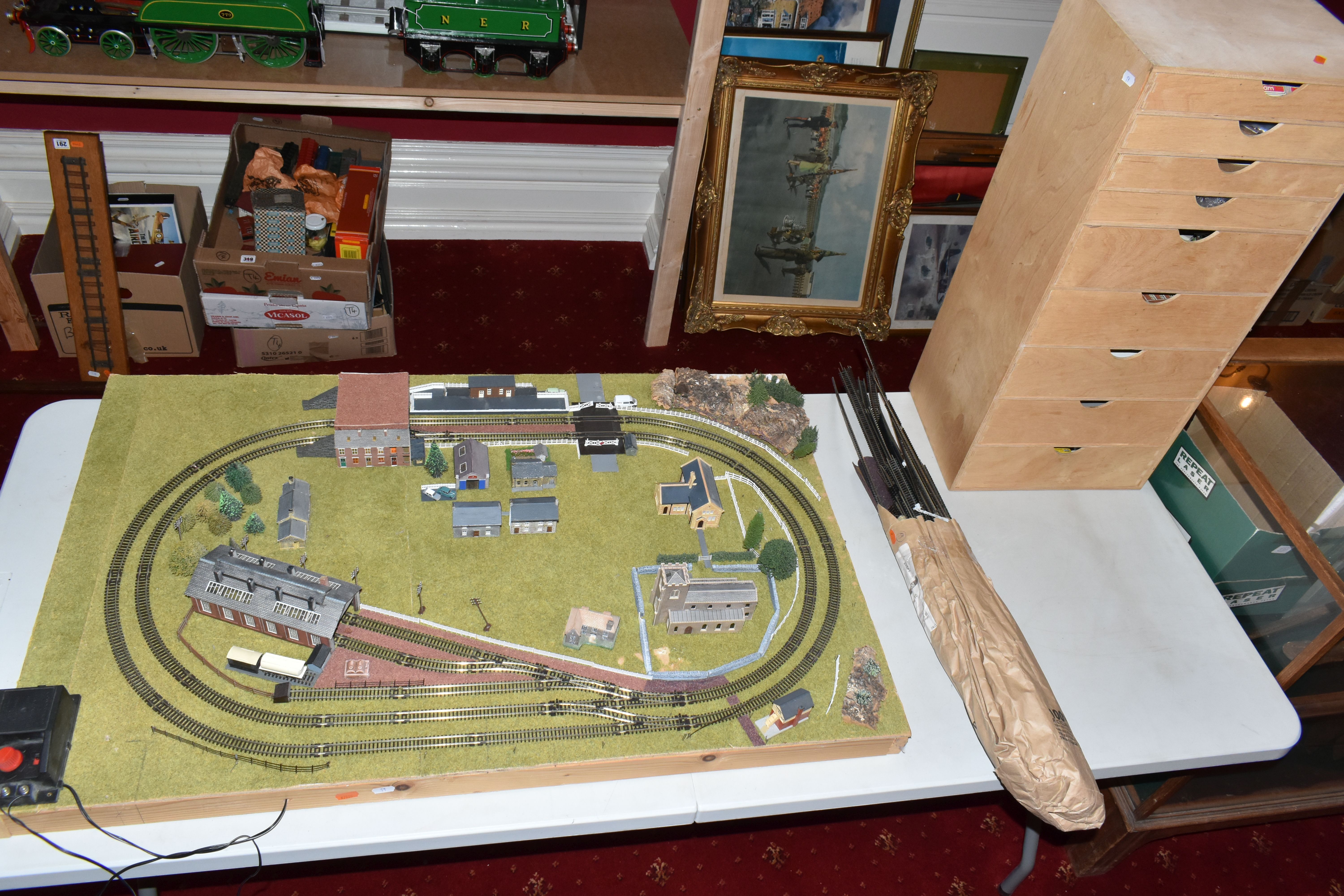 A TABLE TOP N GAUGE MODEL RAILWAY LAYOUT, hardboard base mounted on timber battens, oval double