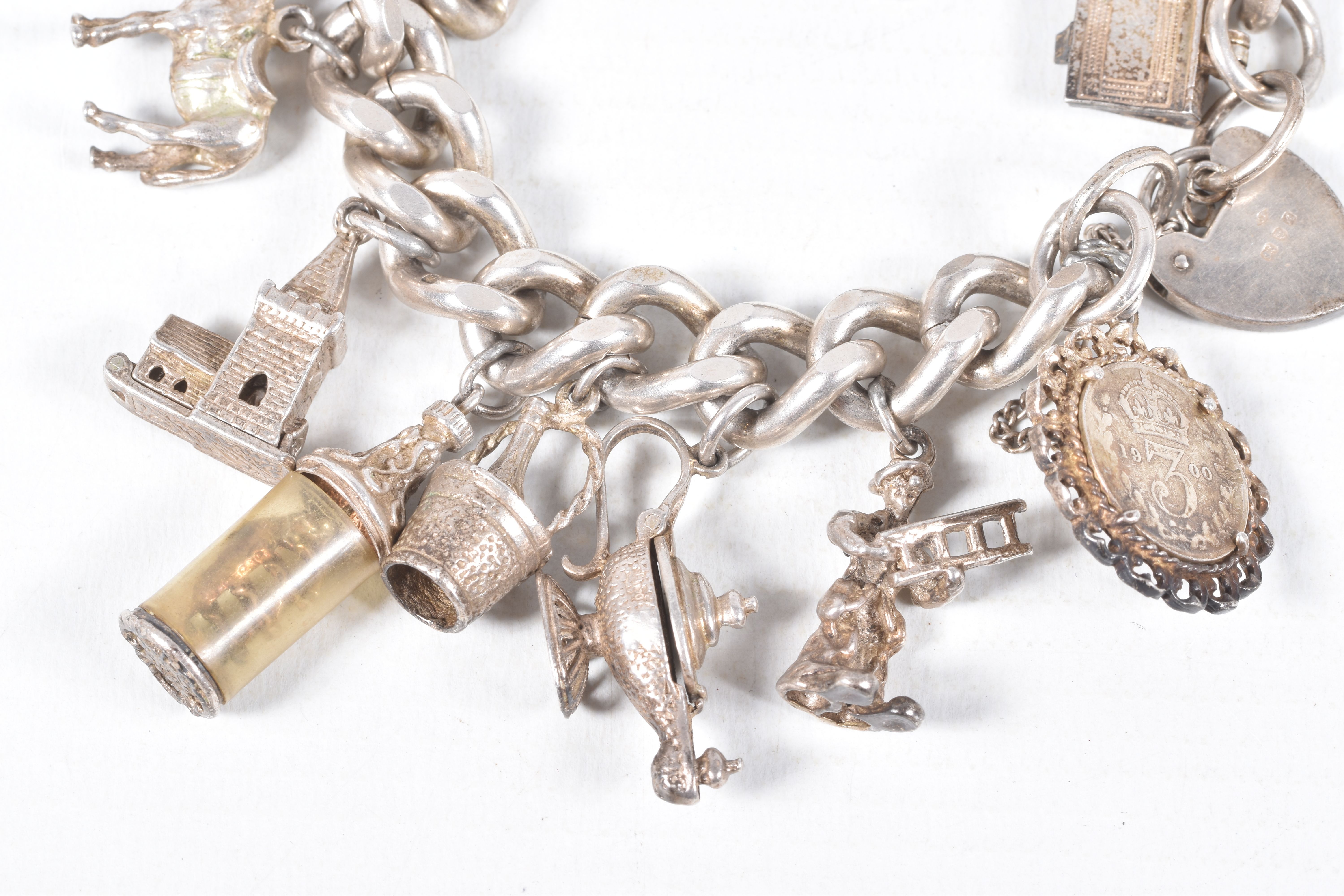 A SILVER CHARM BRACELET, a heavy curb link bracelet fitted with a heart padlock clasp, hallmarked ' - Image 2 of 7