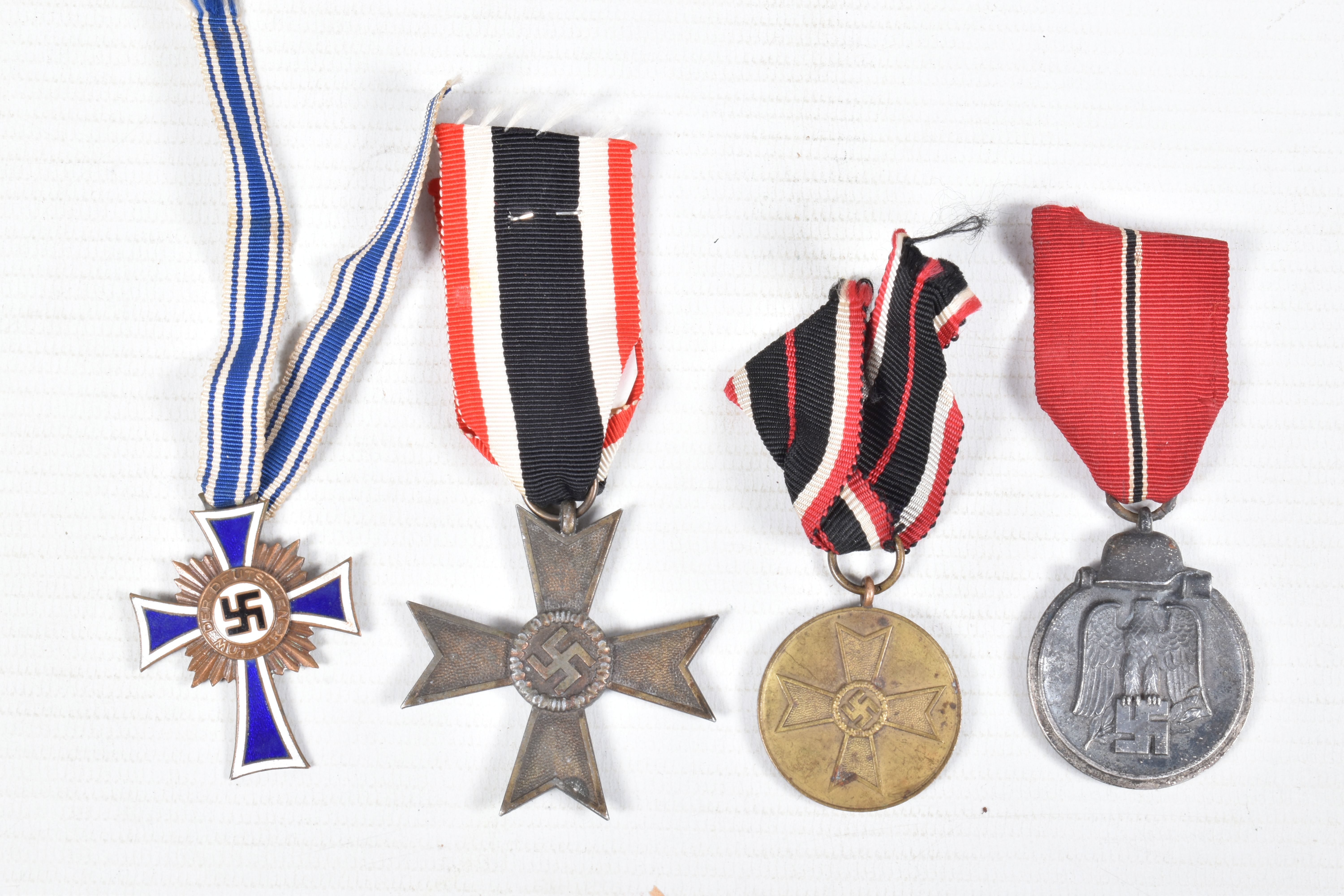 FOUR WWII GERMAN MEDALS AND AWARDS, this lot includes a bronze mothers cross, a war merit cross - Image 2 of 10