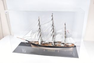 A CONSTRUCTED REVELL PLASTIC KIT OF THE CUTTY SARK HOUSED IN A PERSPEX DISPLAY CASE, kit has been