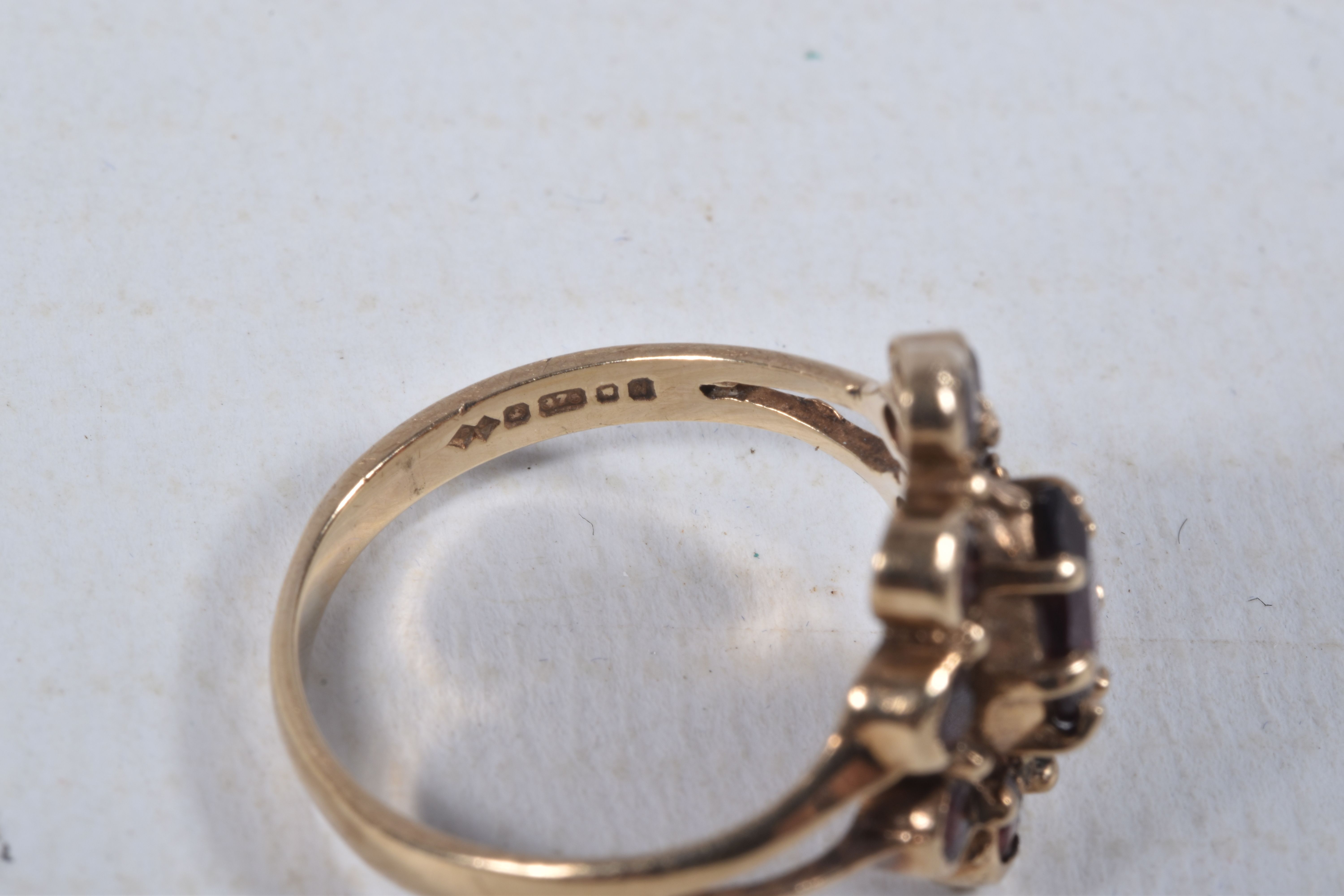 A 9CT GOLD GARNET CLUSTER RING, designed as a central pear shape garnet within a circular cut garnet - Image 4 of 4