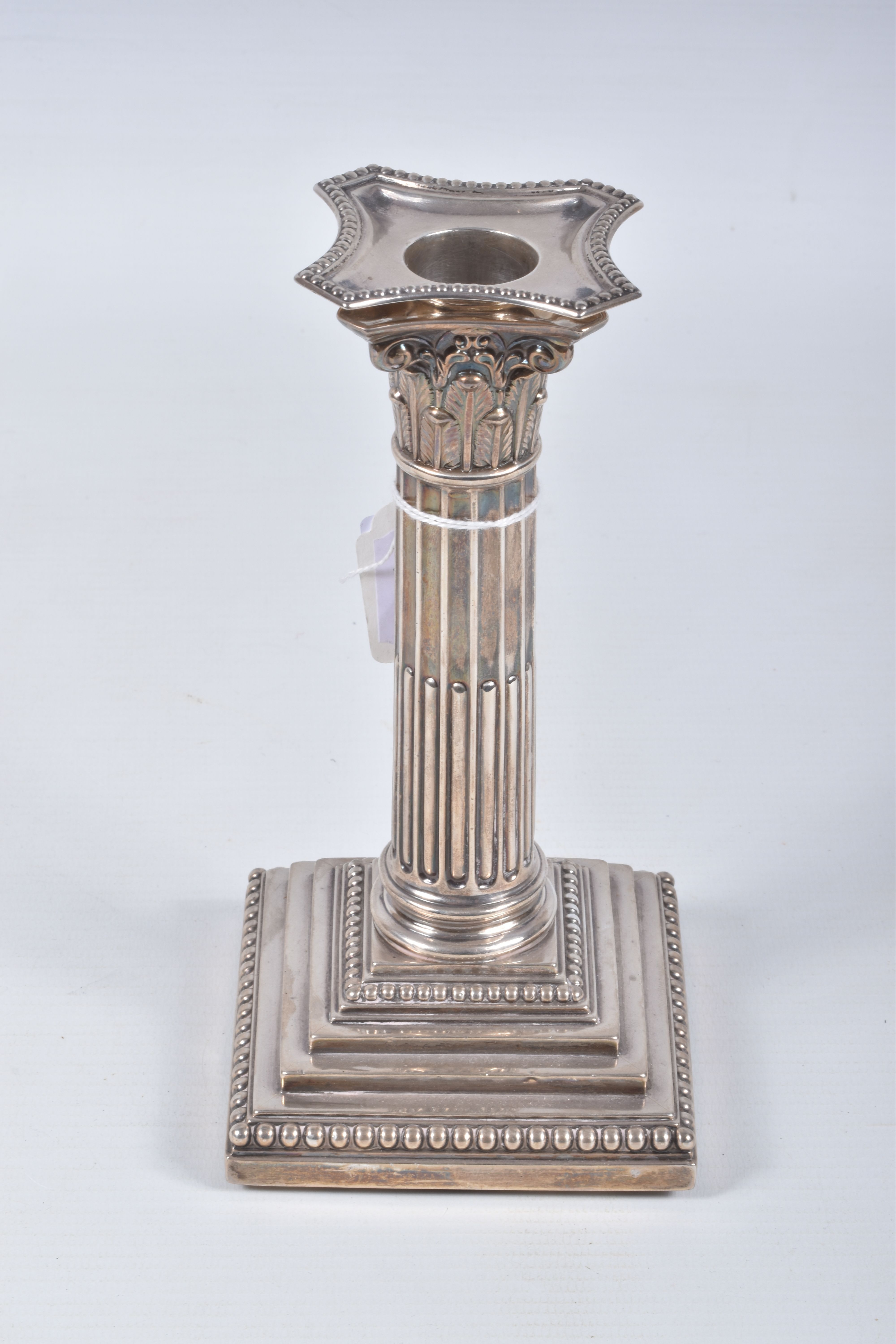 A PAIR OF LATE VICTORIAN SILVER CANDLE STICKS, Corinthian columns scroll leaf detail, on square - Image 6 of 8