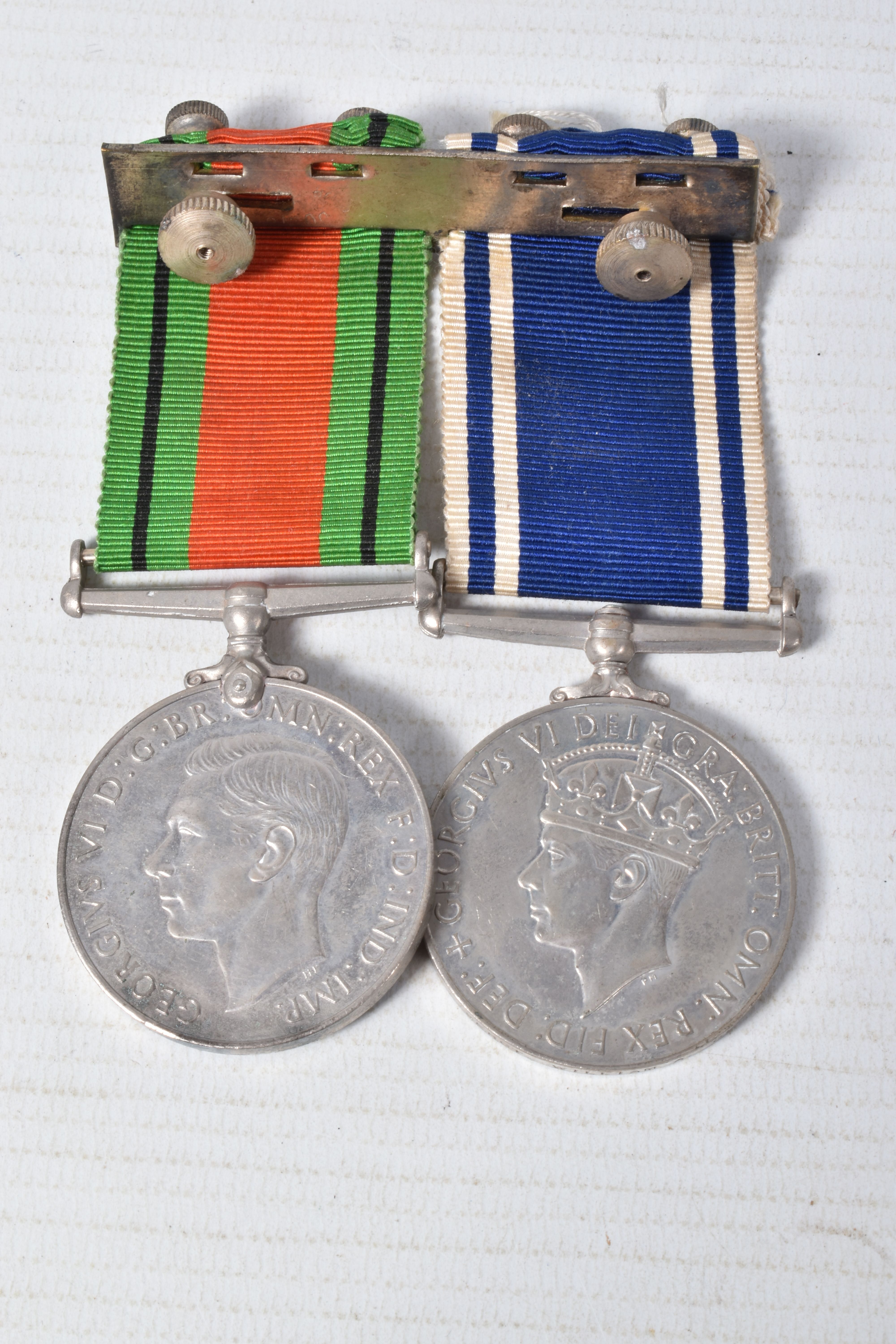 A POLICE LONG SERVICE MEDAL AND WWII DEFENCE MEDAL, police cap badge and epaulette numbers, the - Image 6 of 7