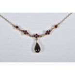 A CZECHOSLOVAKIA SILVER GILT, GARNET NECKLACE, pear cut garnet cabochon dropper in a milgrain