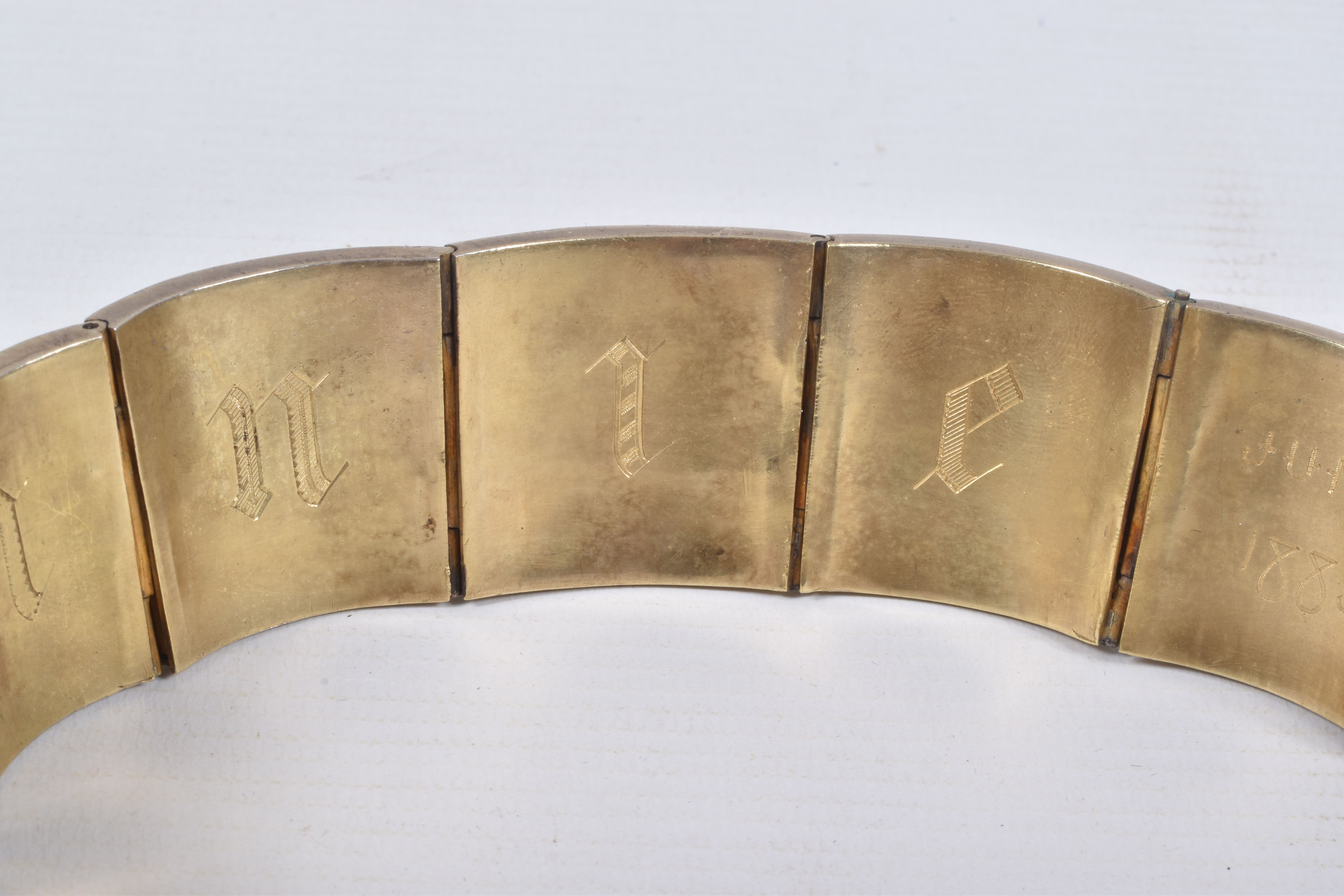 A VICTORIAN GILT BRACELET, comprised of six slightly tapered panels, embossed with an Indian design, - Image 4 of 5