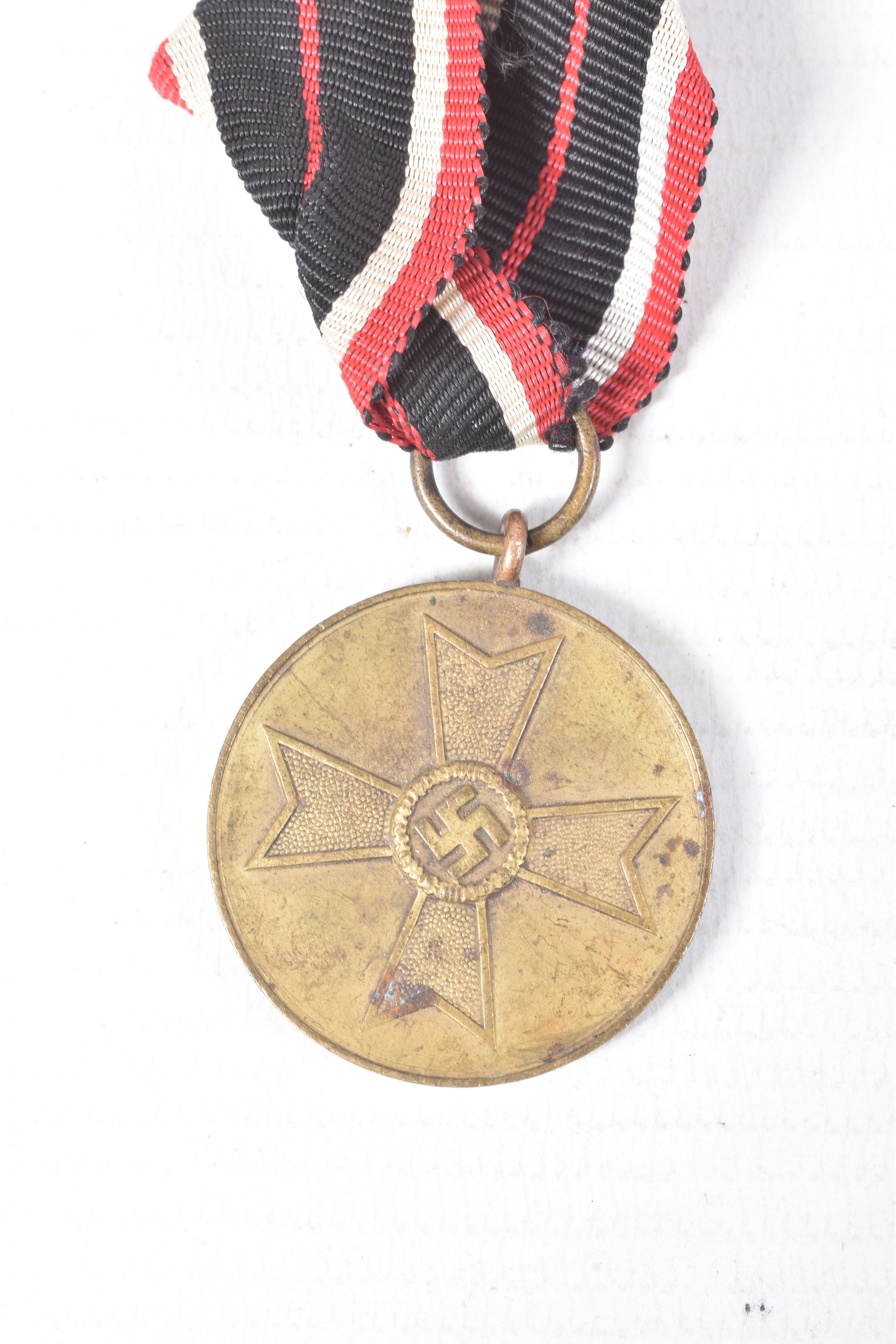 FOUR WWII GERMAN MEDALS AND AWARDS, this lot includes a bronze mothers cross, a war merit cross - Image 7 of 10