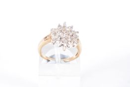 A 9CT GOLD DIAMOND CLUSTER RING, nineteen round brilliant cut diamonds and six baguette cut diamonds