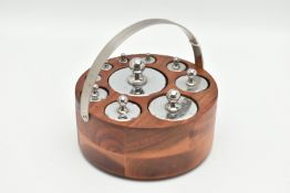 A MODERN SET OF TEN CYLINDRICAL STAINLESS STEEL WEIGHTS FITTED IN A CIRCULAR WOODEN STAND WITH