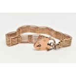 A ROSE METAL GATE BRACELET, a six bar gate bracelet, fitted with a heart padlock clasp,