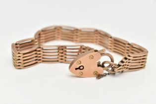 A ROSE METAL GATE BRACELET, a six bar gate bracelet, fitted with a heart padlock clasp,