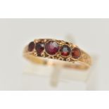 A 15CT GOLD MID VICTORIAN GARNET RING, five circular cut garnets set in yellow gold, scrolling