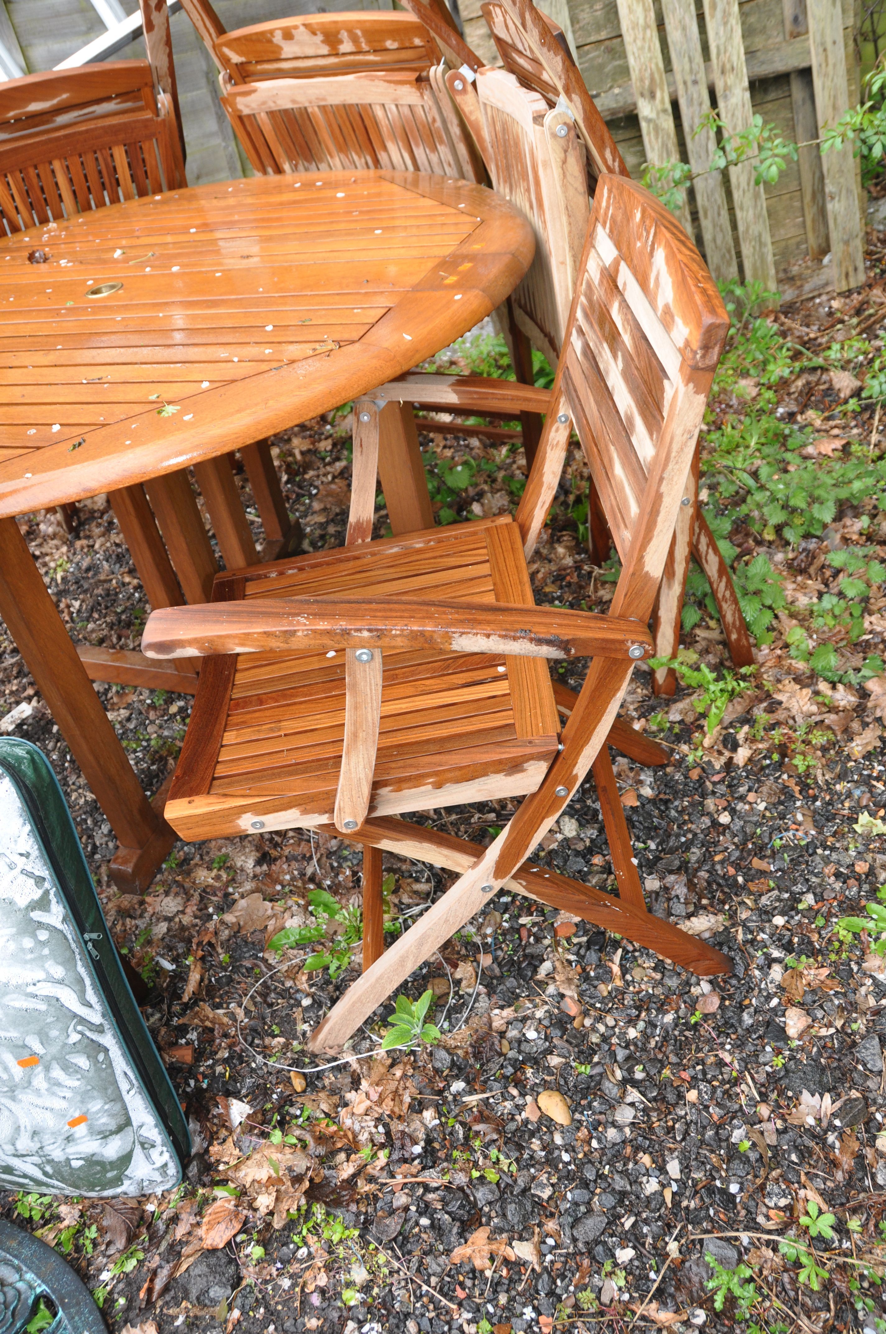 A MILAN COLLECTION TEAK GARDEN SET consisting of a 123cm diameter table, six folding chairs, a - Image 2 of 4