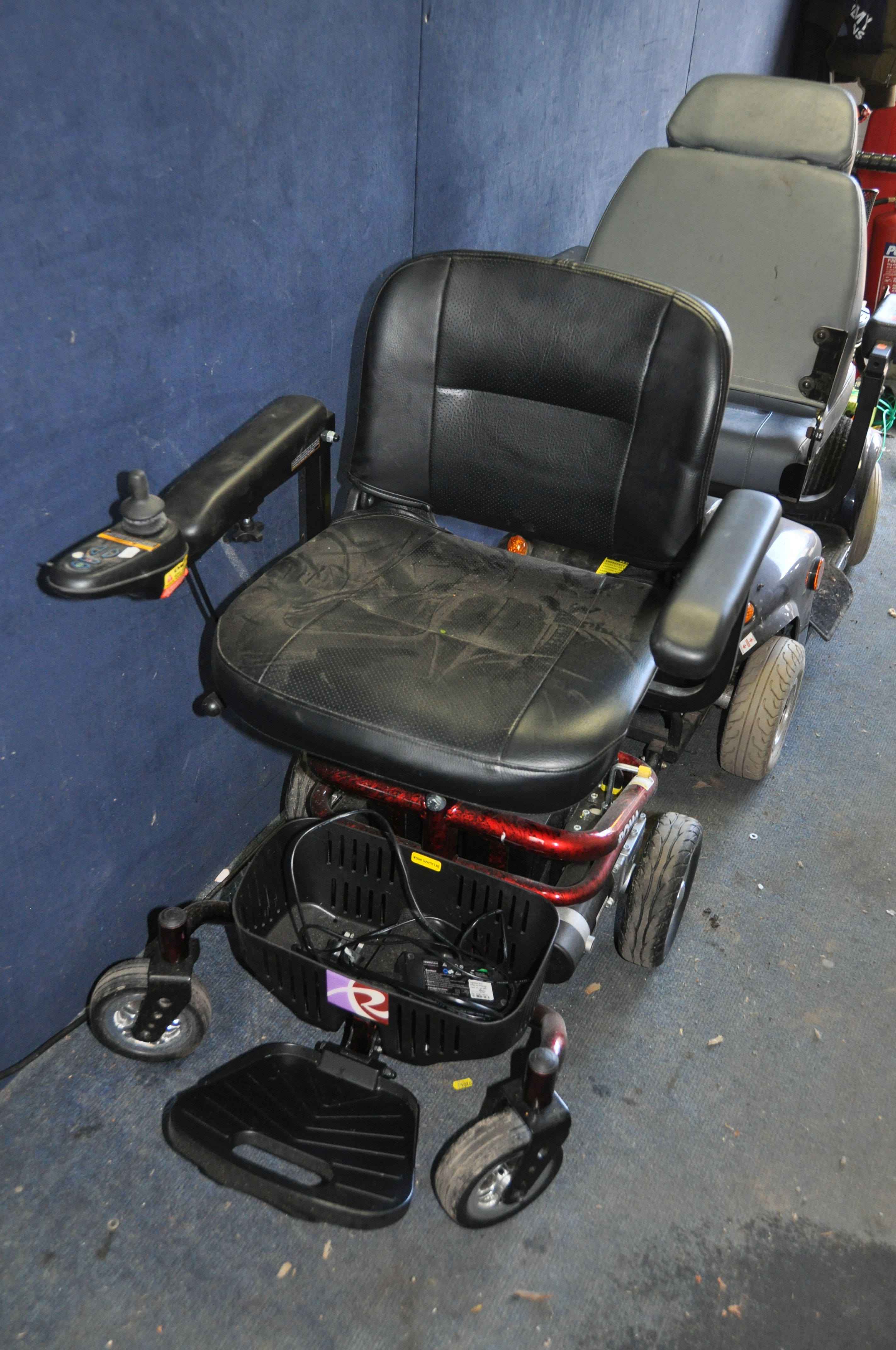 A ROMA ELECTRIC WHEEL CHAIR in red (SPARES OR REPAIRS) with battery and charger (doesn't appear to - Image 2 of 3