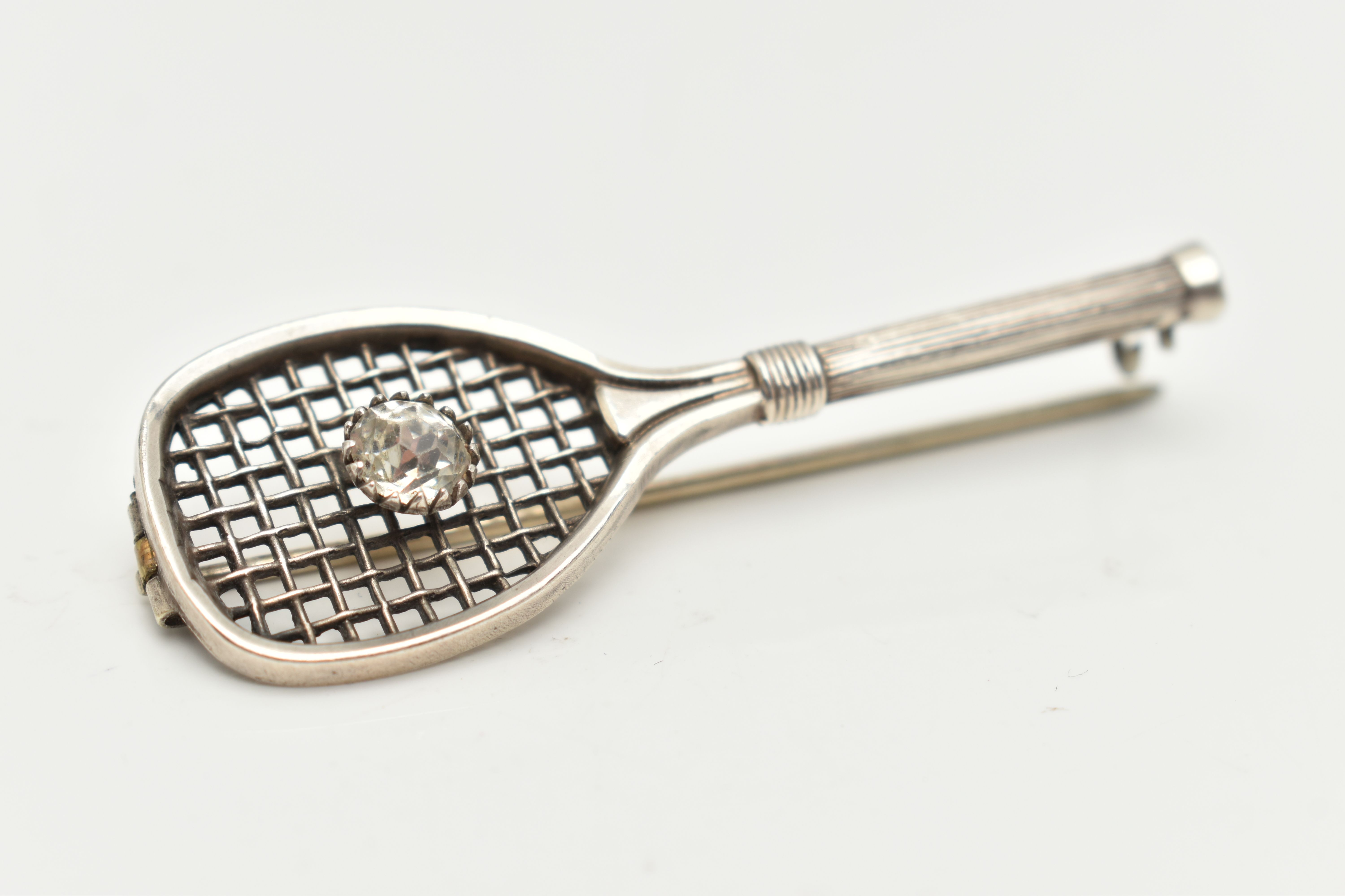 A WHITE METAL BROOCH, in the form of a tennis racket set with a colourless paste imitating a - Image 2 of 4