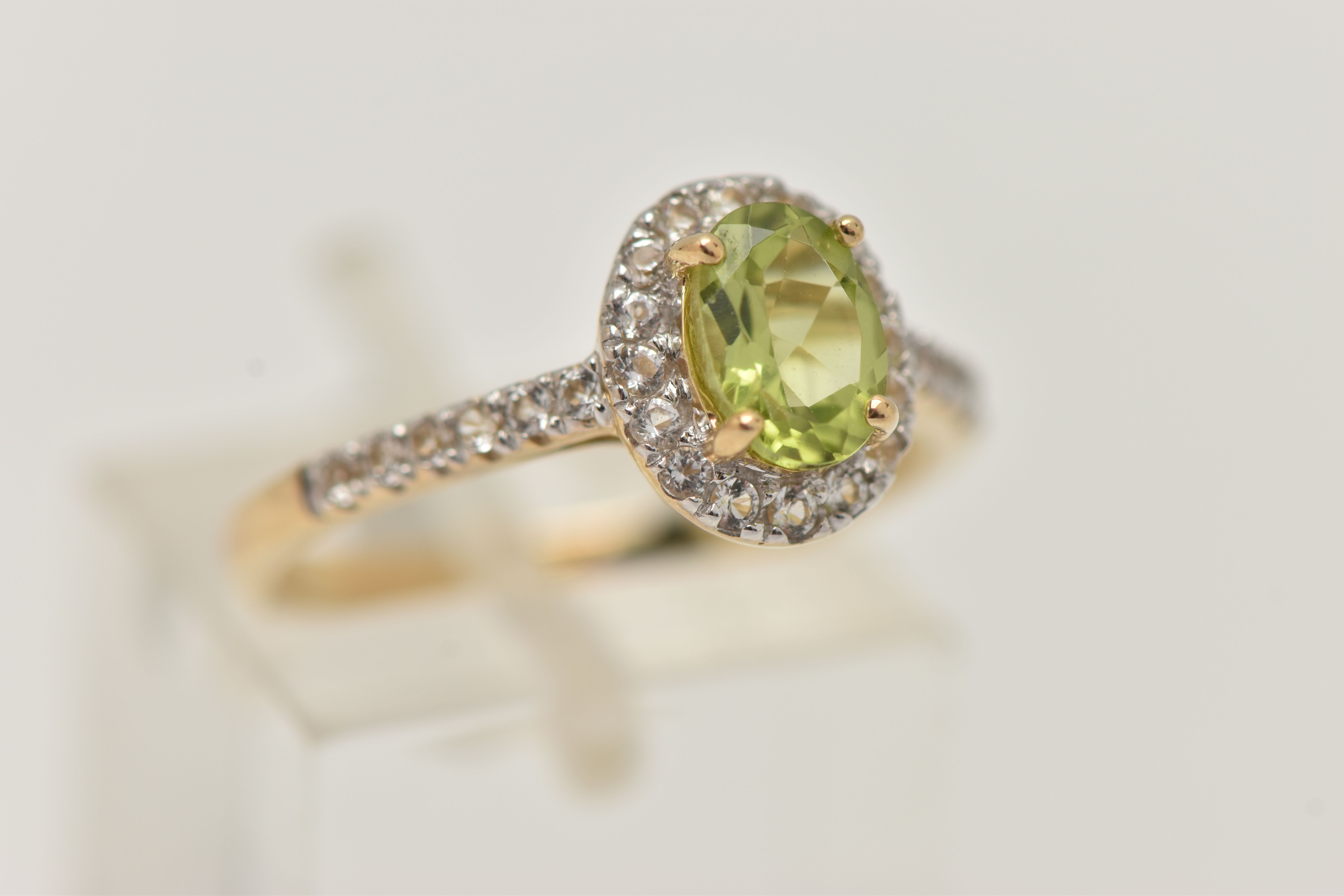 A 9CT GOLD PERIDOT DRESS RING, a principally set oval cut peridot, prong set in yellow gold, set - Image 4 of 4