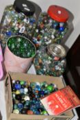A COLLECTION OF GLASS MARBLES, of various sizes and designs, solid colours, swirl and confetti