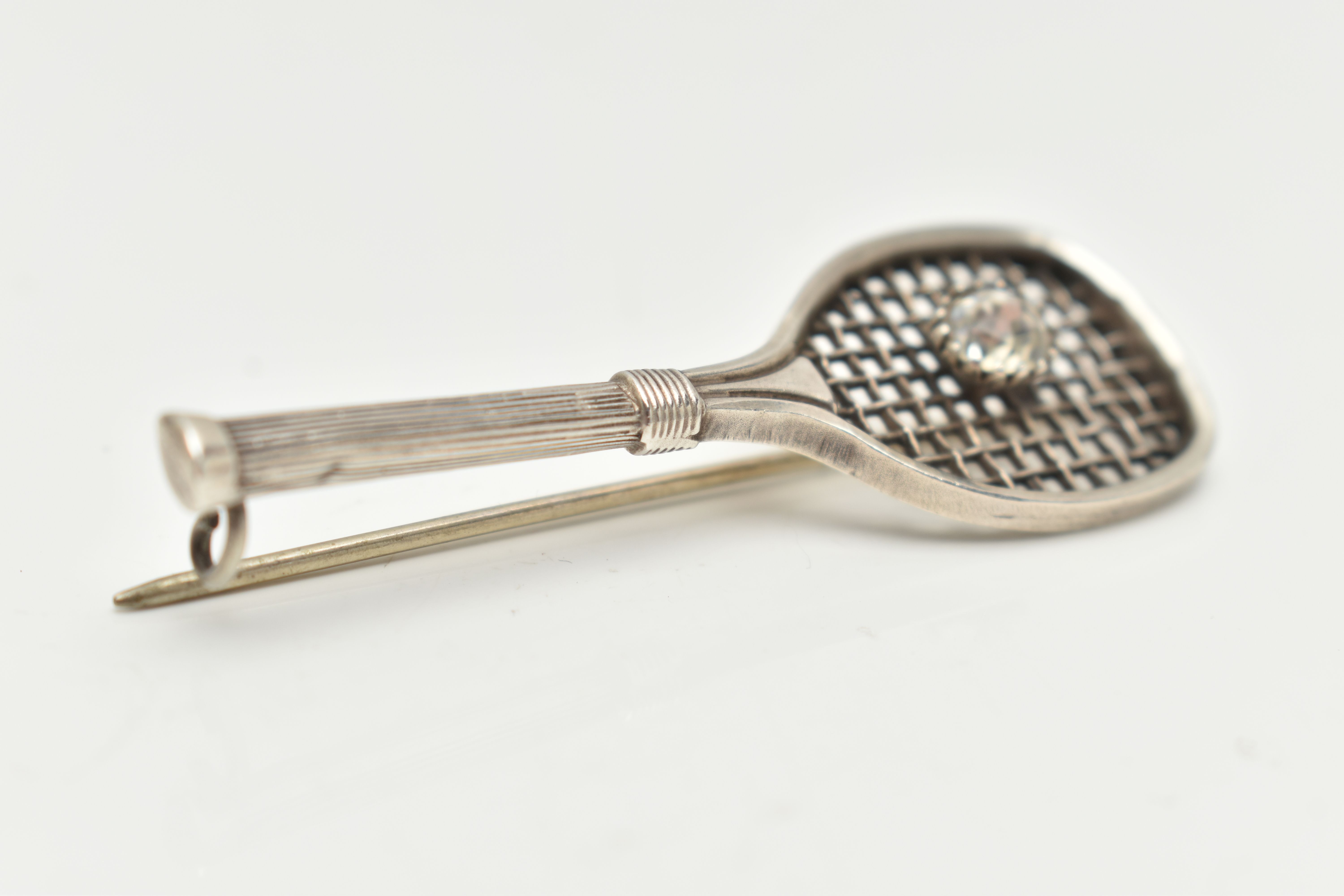 A WHITE METAL BROOCH, in the form of a tennis racket set with a colourless paste imitating a - Image 3 of 4