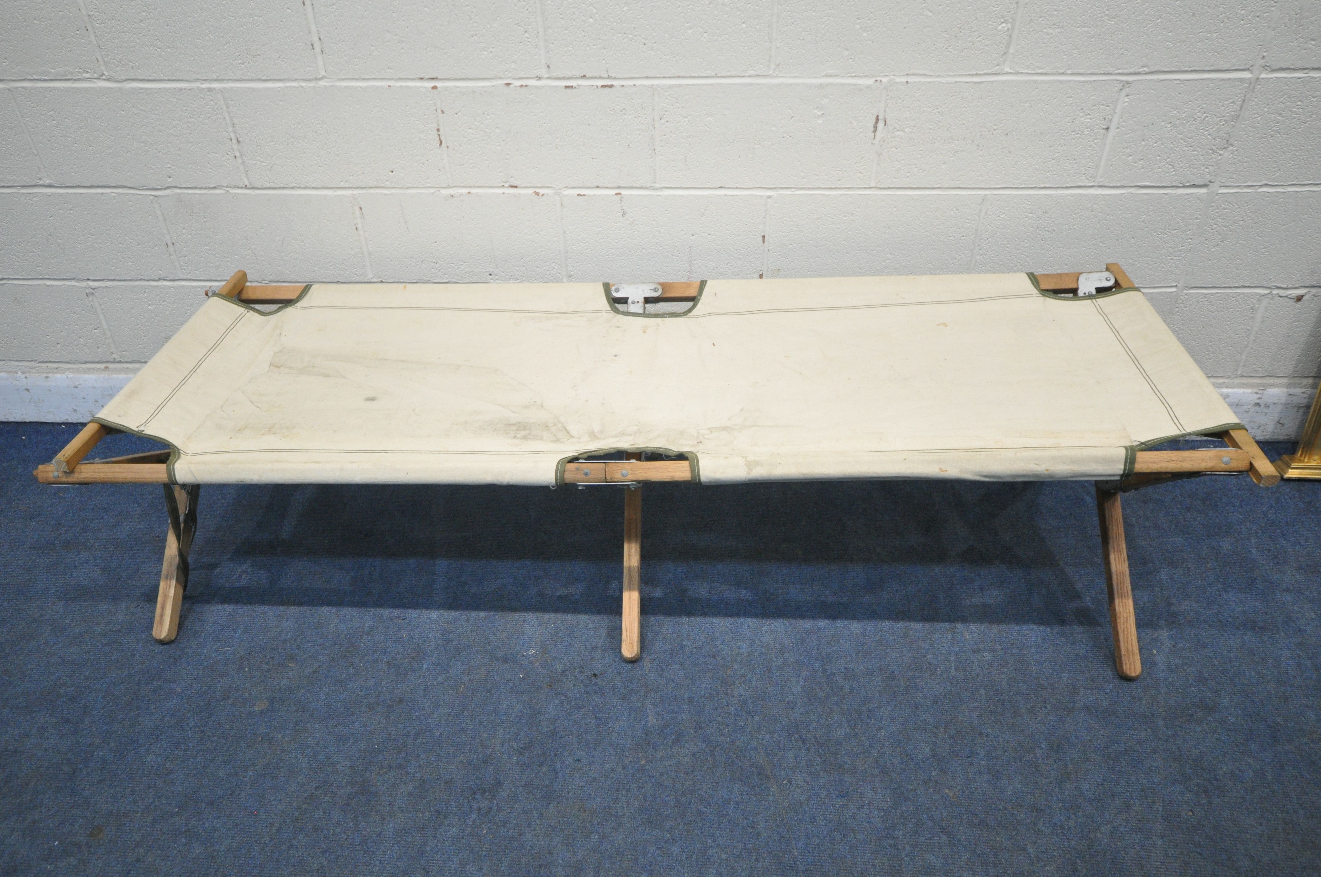 A 20TH CENTURY FOLDING CAMPAIGN STYLE BED, length 195cm (condition report: slightly tear to