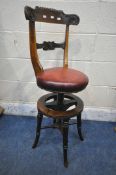 A 19TH CENTURY ROSEWOOD MUSICIAN / HARPIST SWIVEL CHAIR, with scrolled and foliate backrest, oxblood
