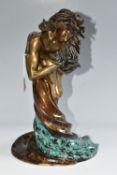 A LIMITED EDITION BONDED BRONZE OR BRONZED RESIN SCULPTURE, depicting two figures in an embrace,