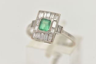 A WHITE METAL EMERALD AND DIAMOND RING, Art Deco style, the centre set with an emerald cut emerald